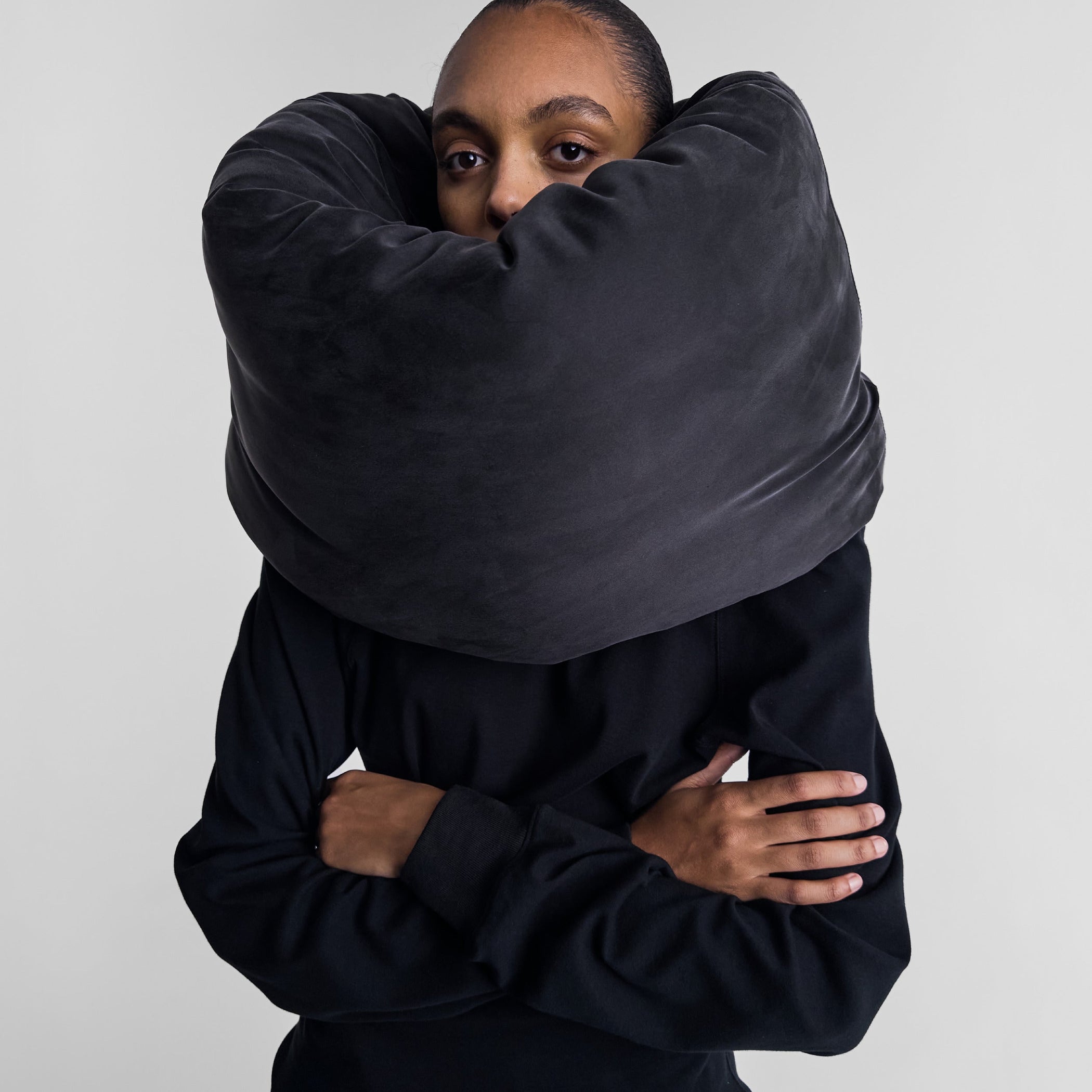 Model wearing PILLOW SCARF in black silk satin