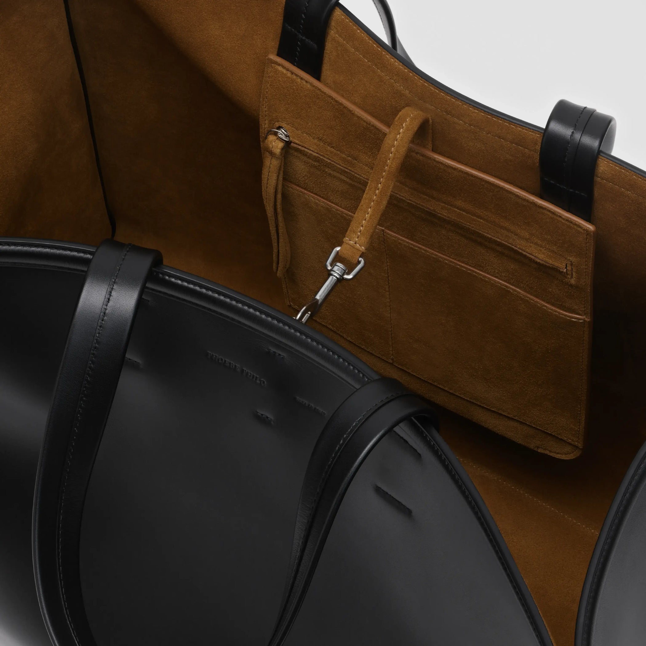 Close up detail view of xl cabas in black leather with silver