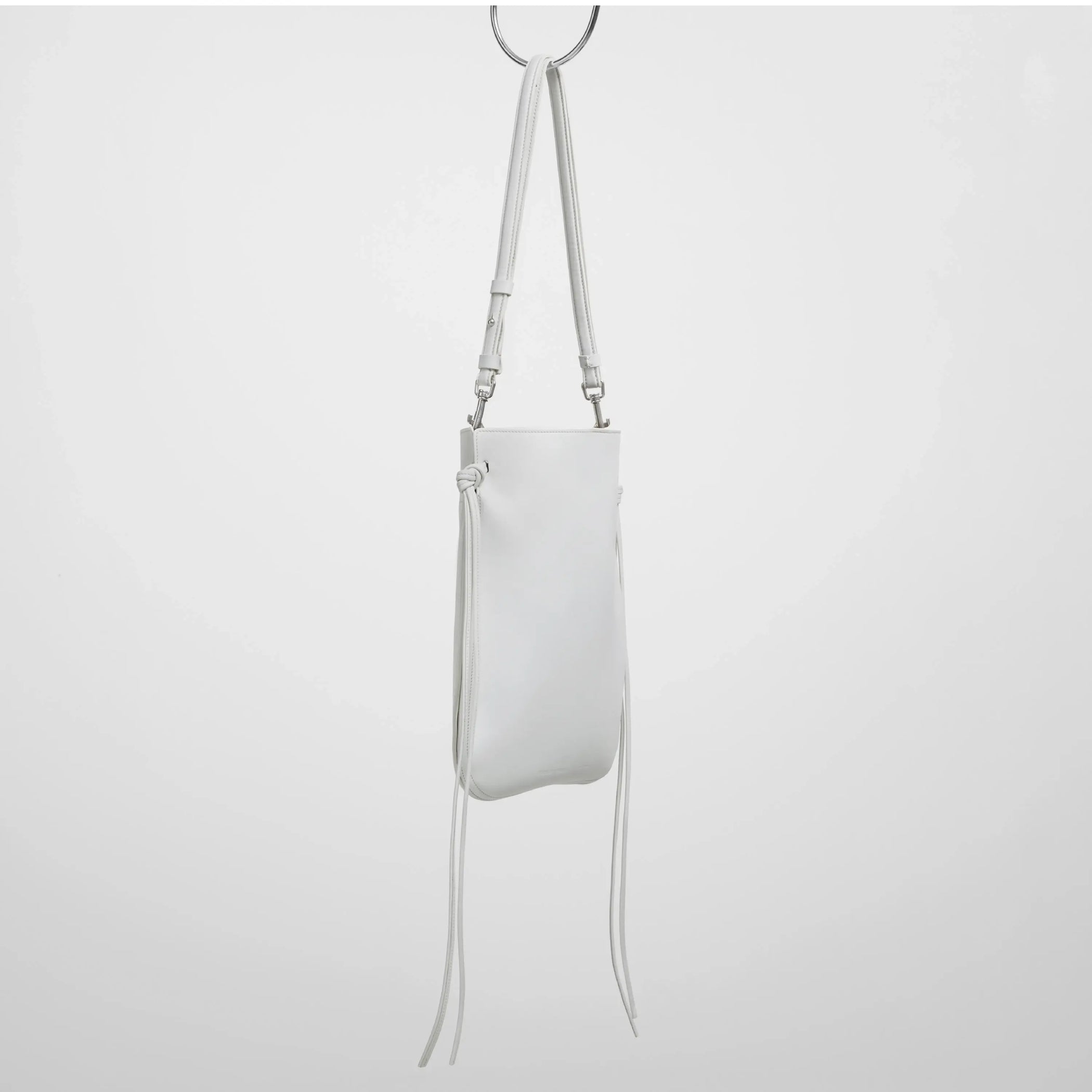 Angled view gig pouch in white leather with silver.