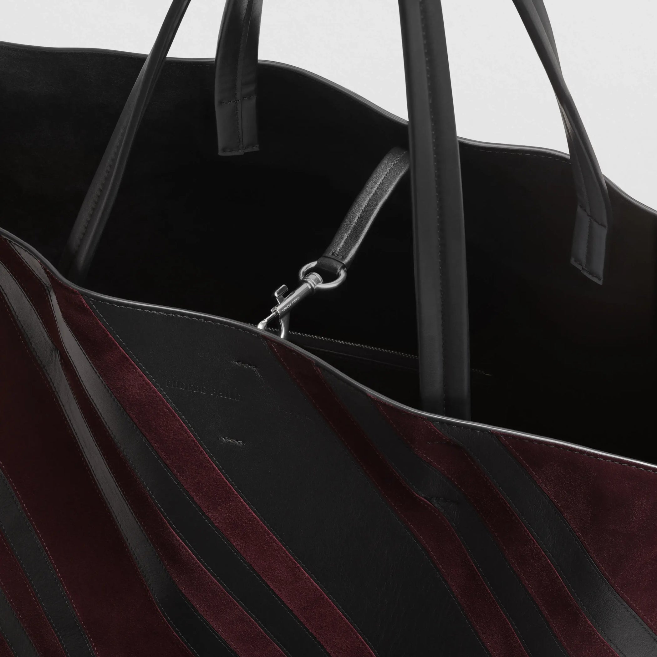 Close up detail view of basket cabas in black oxblood leather and suede with silver