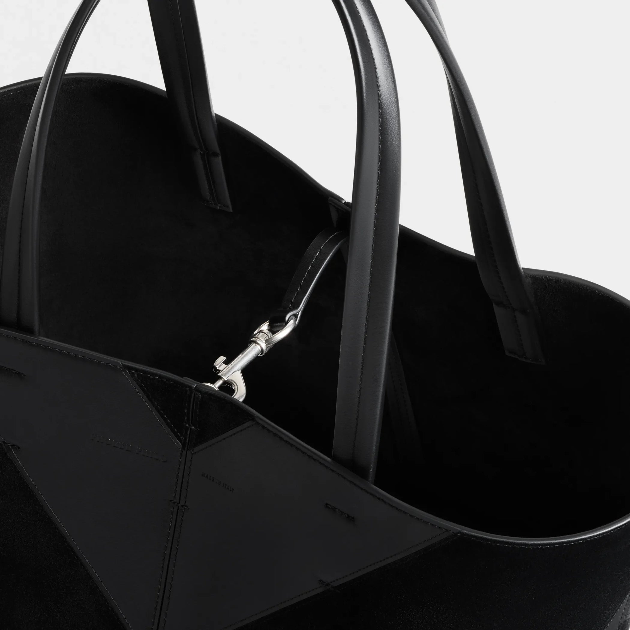 Close up detail view of pot cabas in black suede leather