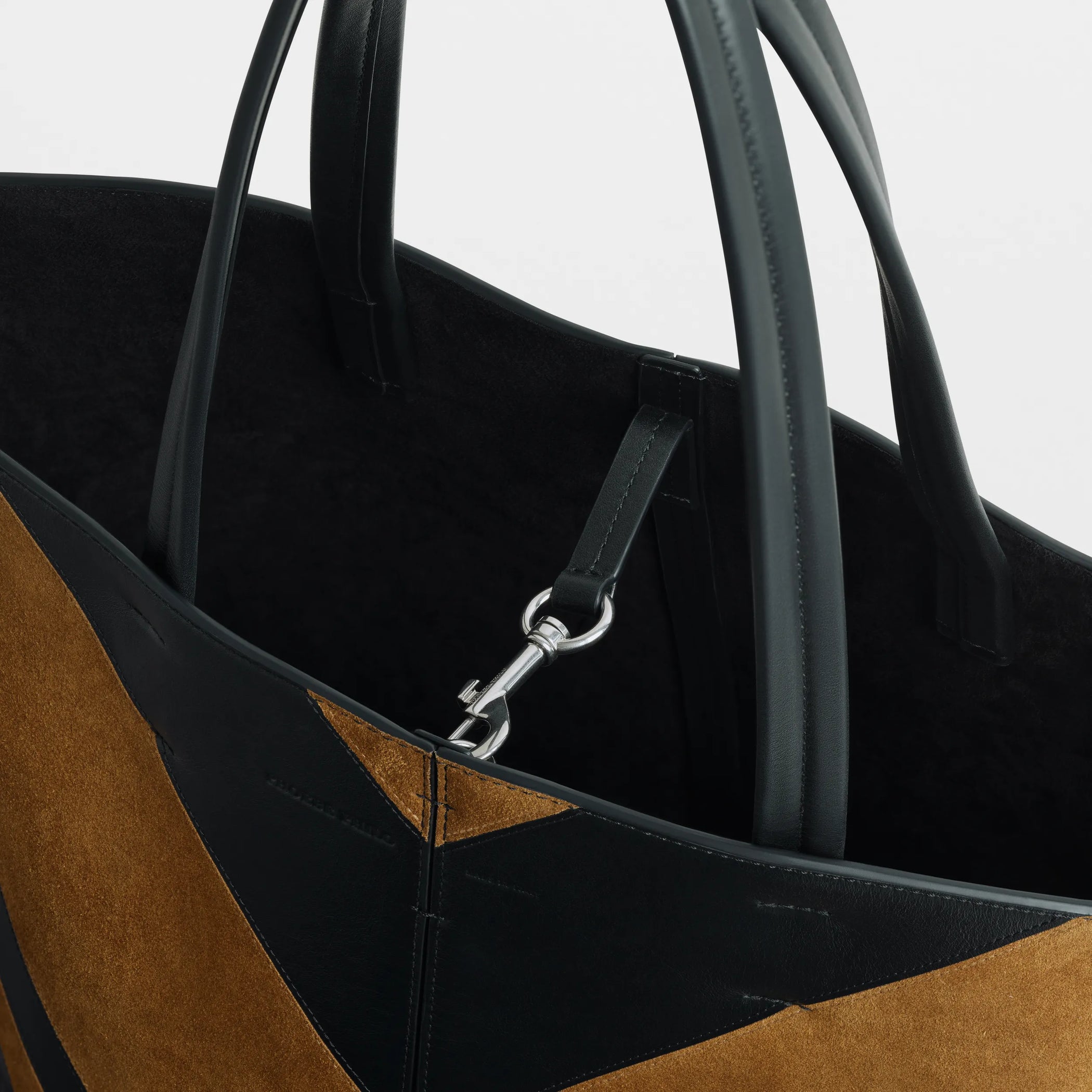 Close up detail view of pot cabas in black toffee leather and suede