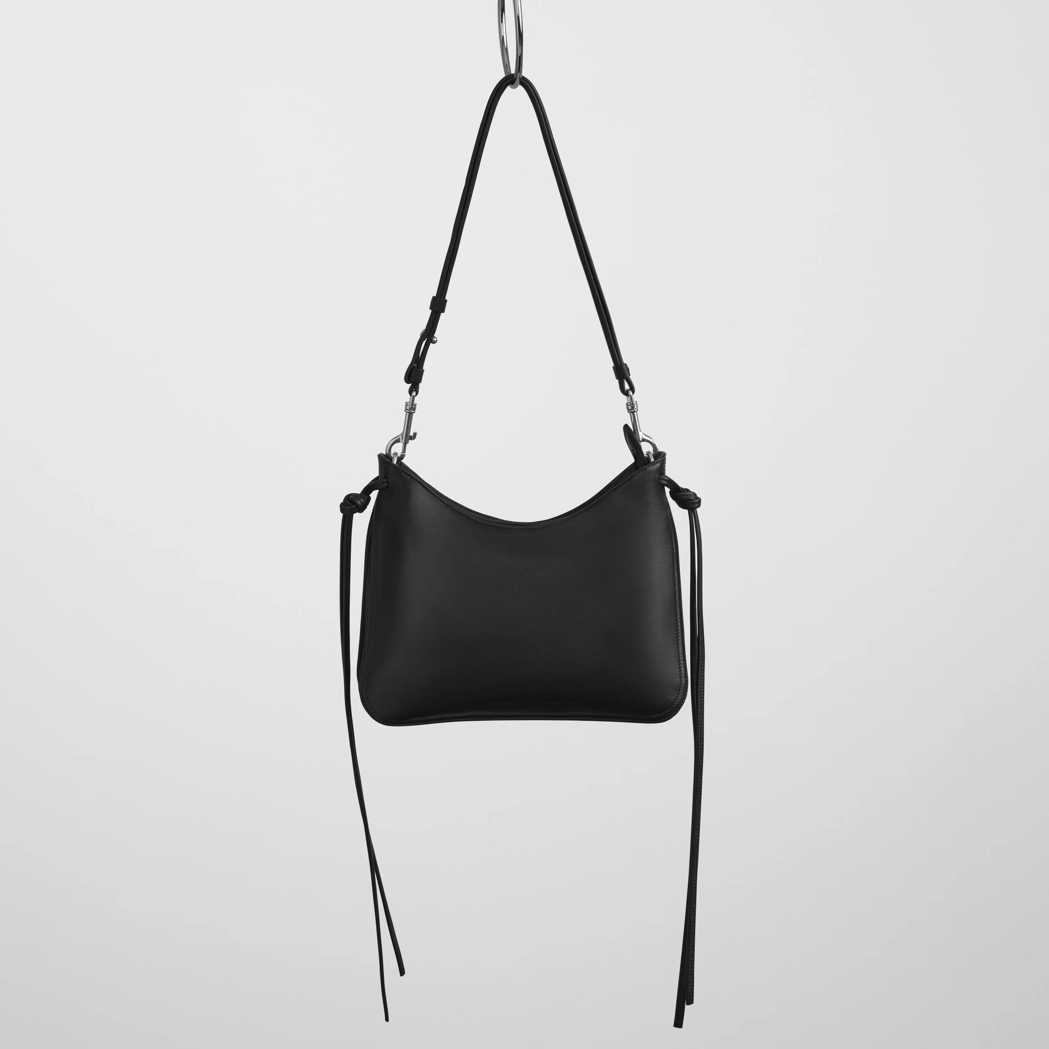 Front view of small gig in black leather.