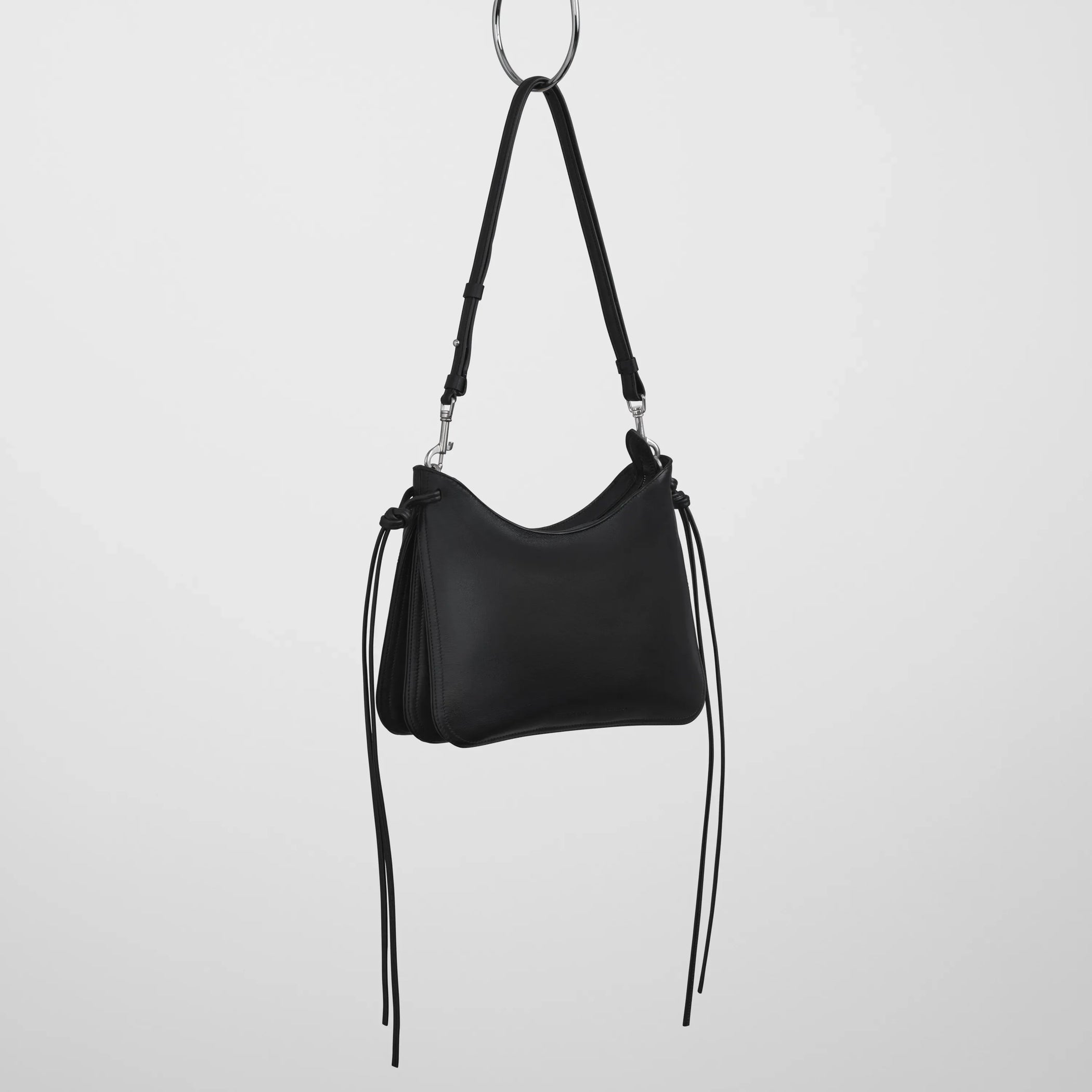 Angled view of small gig in black leather.