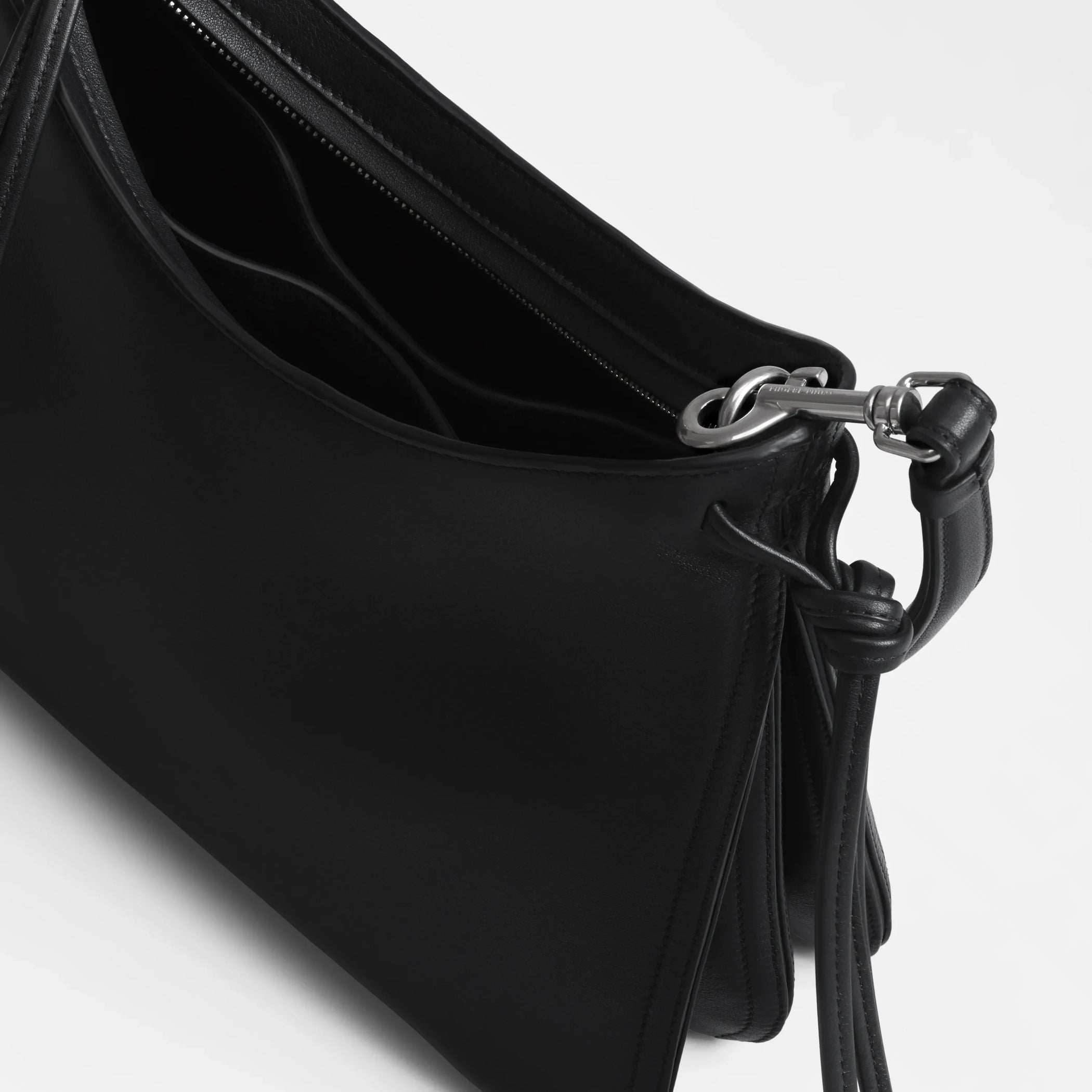 Close up detail view of small gig in black leather.