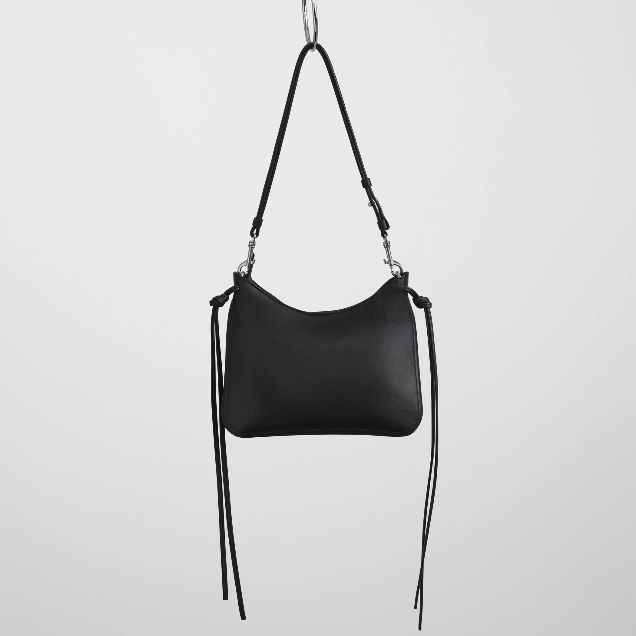 Back view of small gig in black leather.
