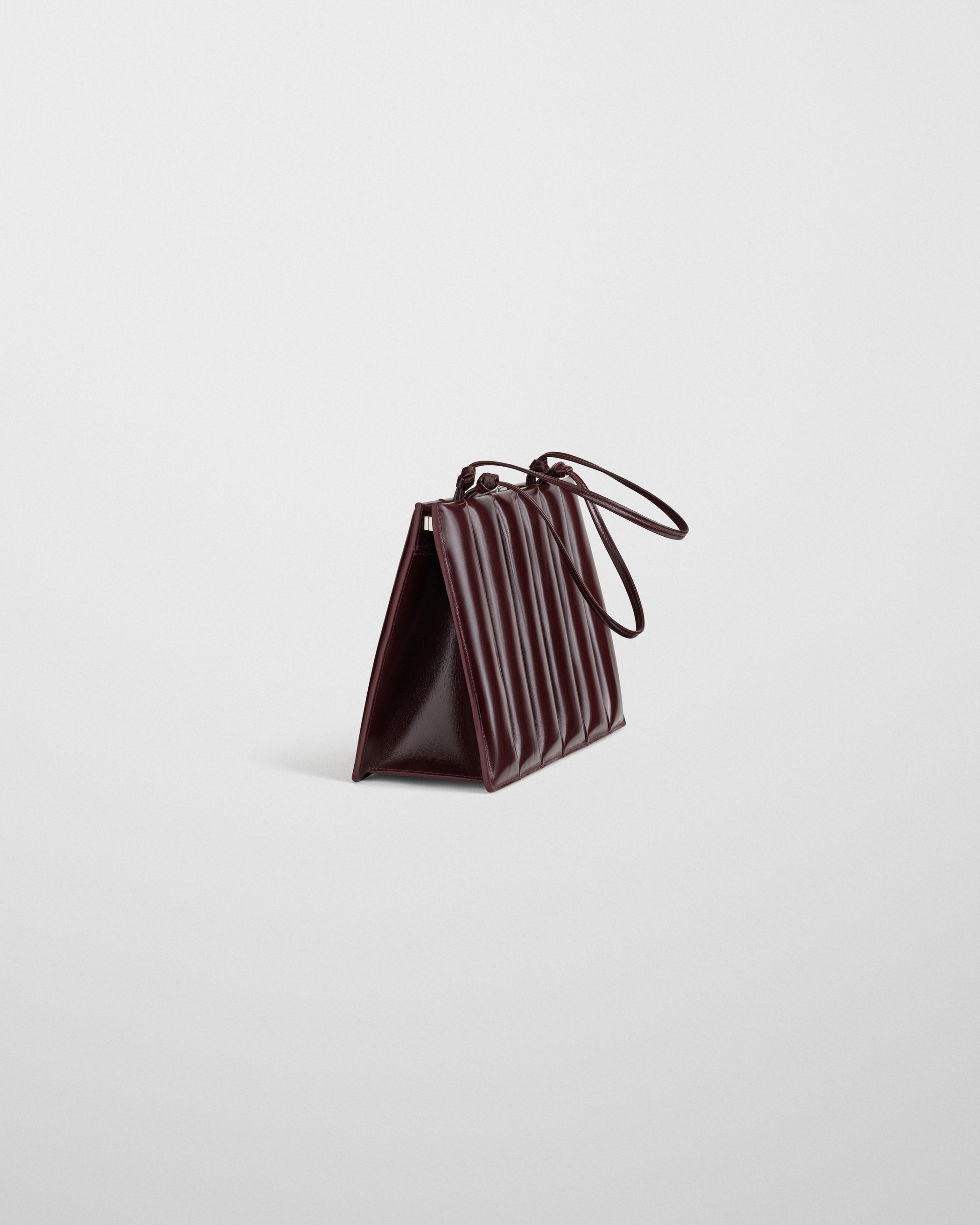 Side view image of the Drive Bag in Oxblood leather
