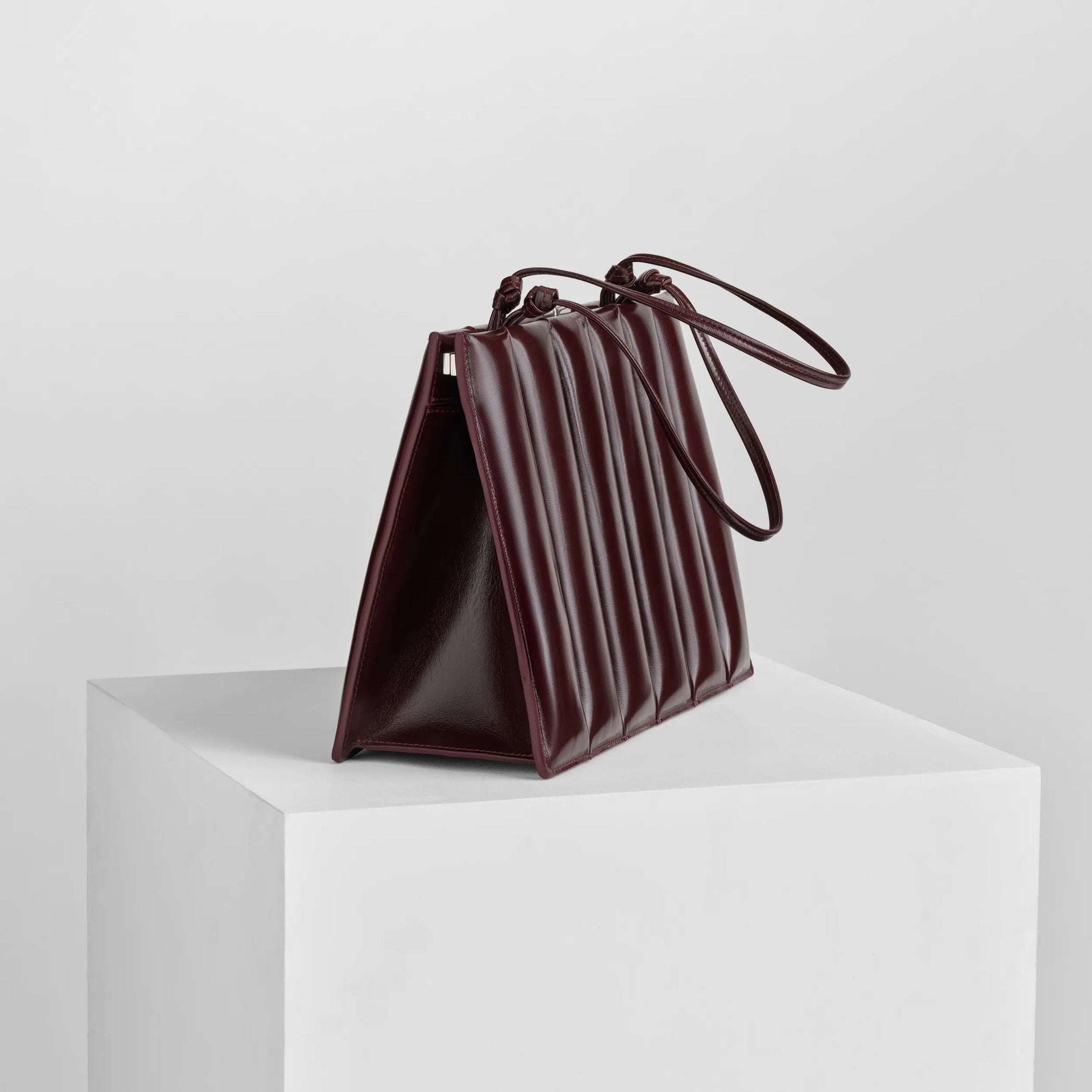 Side view of drive bag in oxblood leather