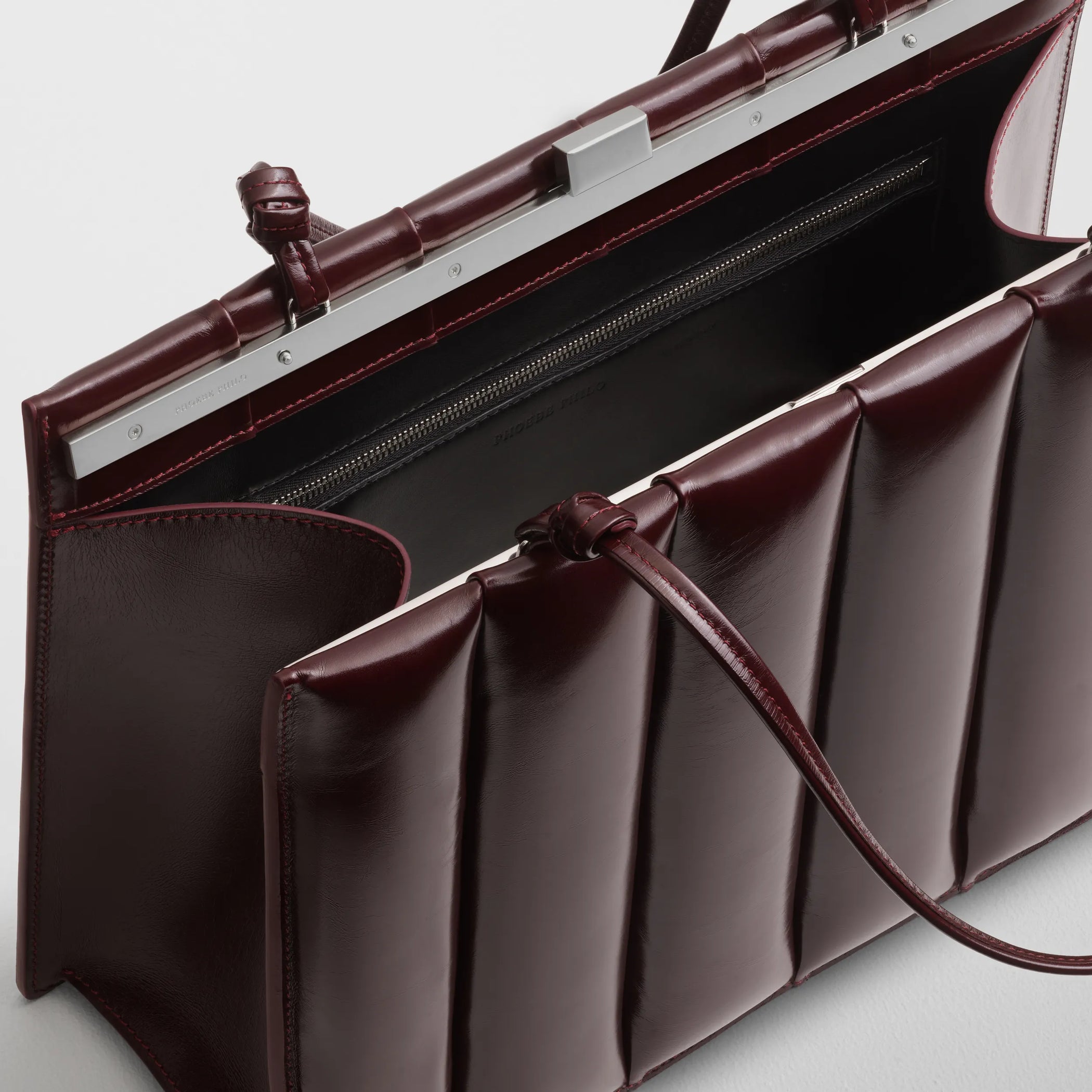 Close up detail view of drive bag in oxblood leather