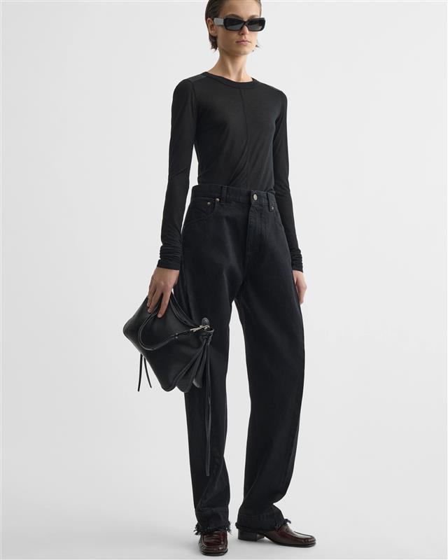 Model holding GIG BAG in black leather