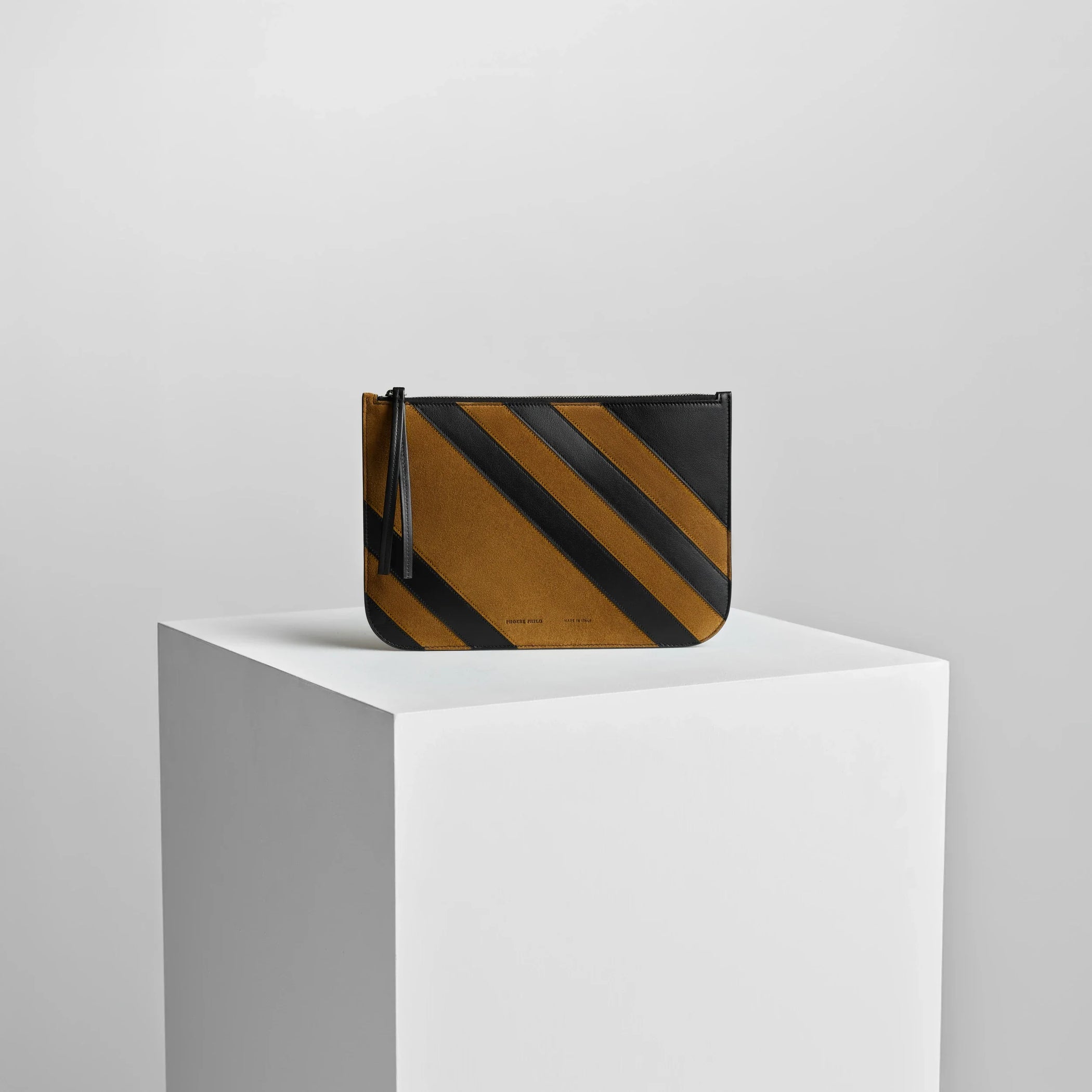 Front view of pocket pouch in toffee/black leather.