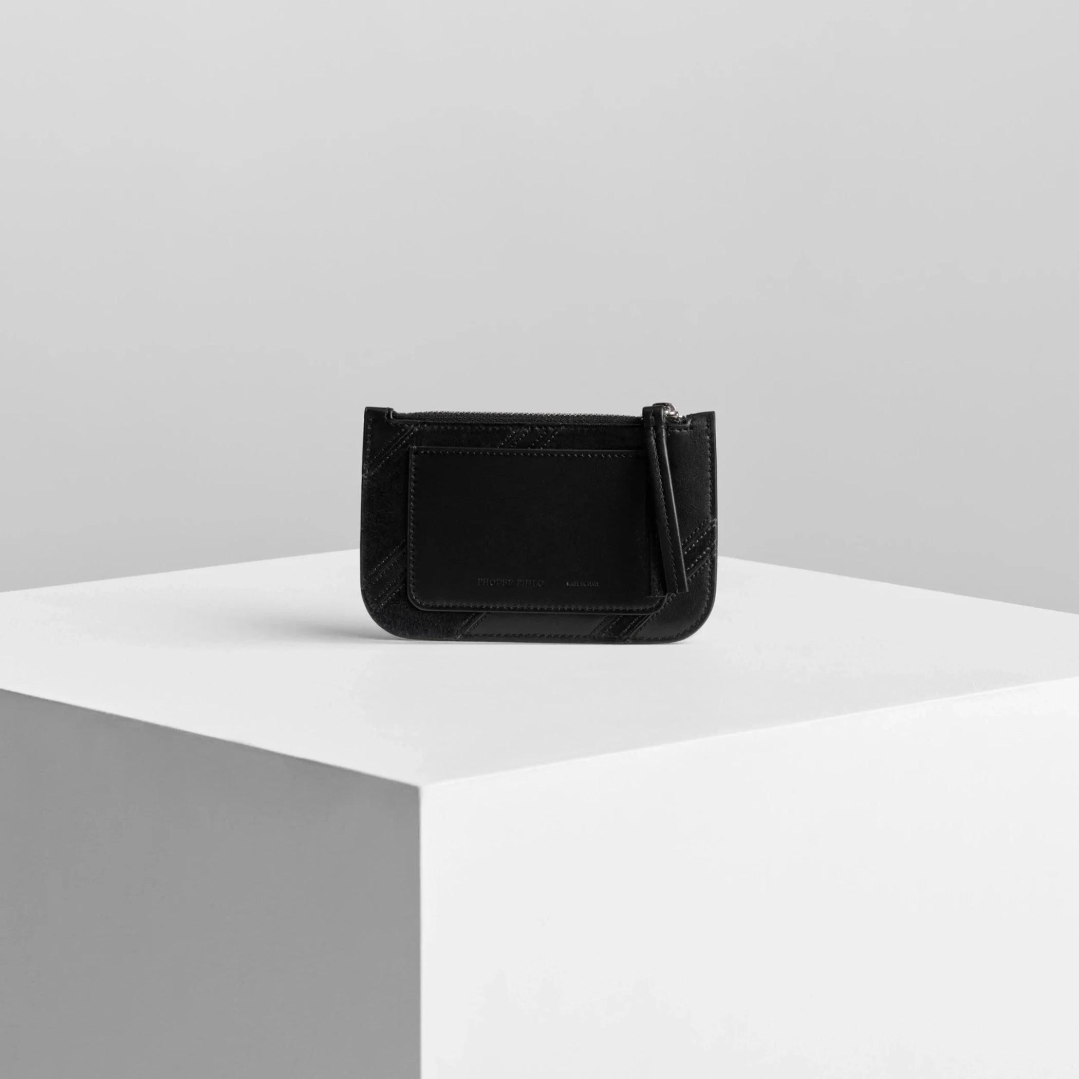 Back view of pocket card holder in black leather.