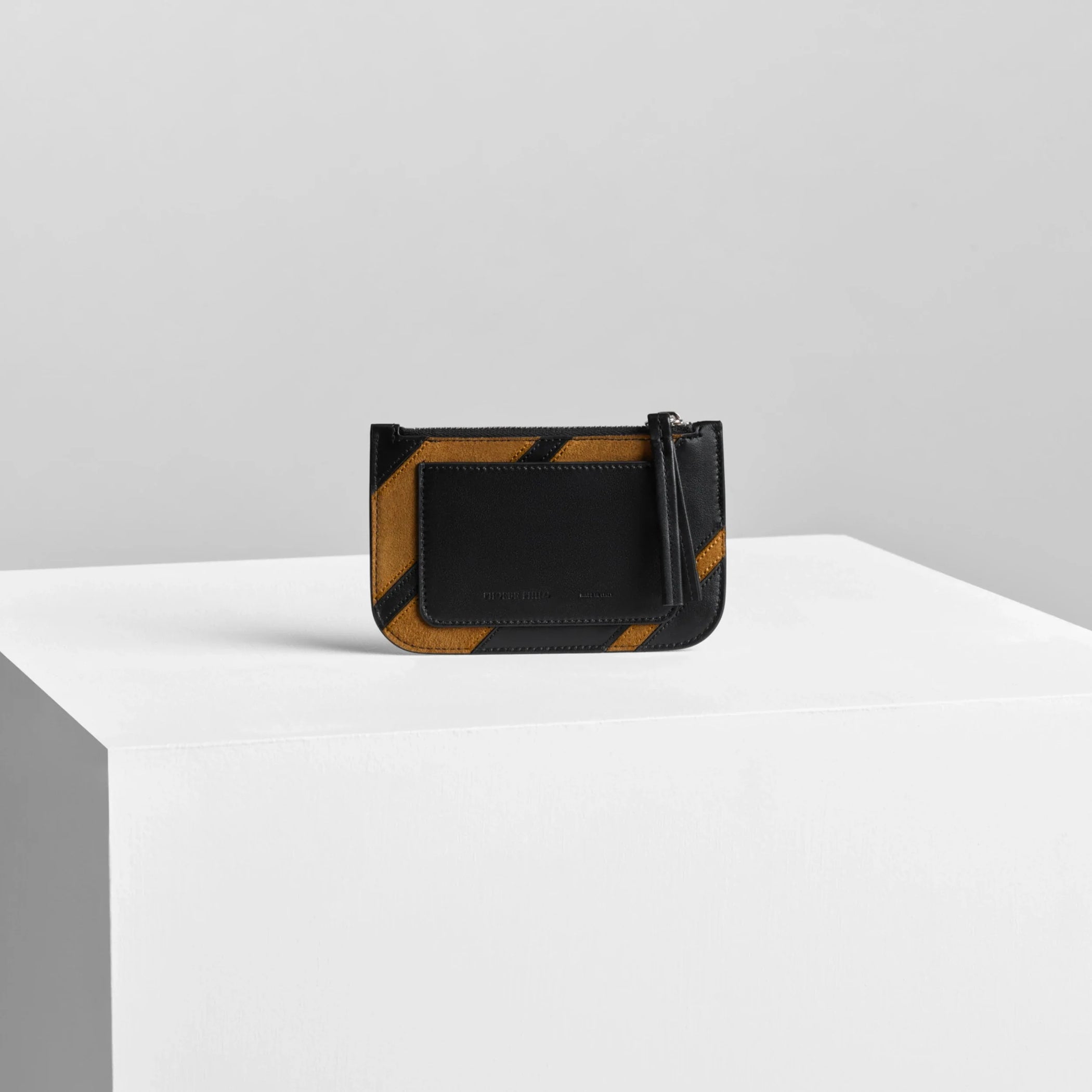 Back view of pocket card holder in toffee/black leather.