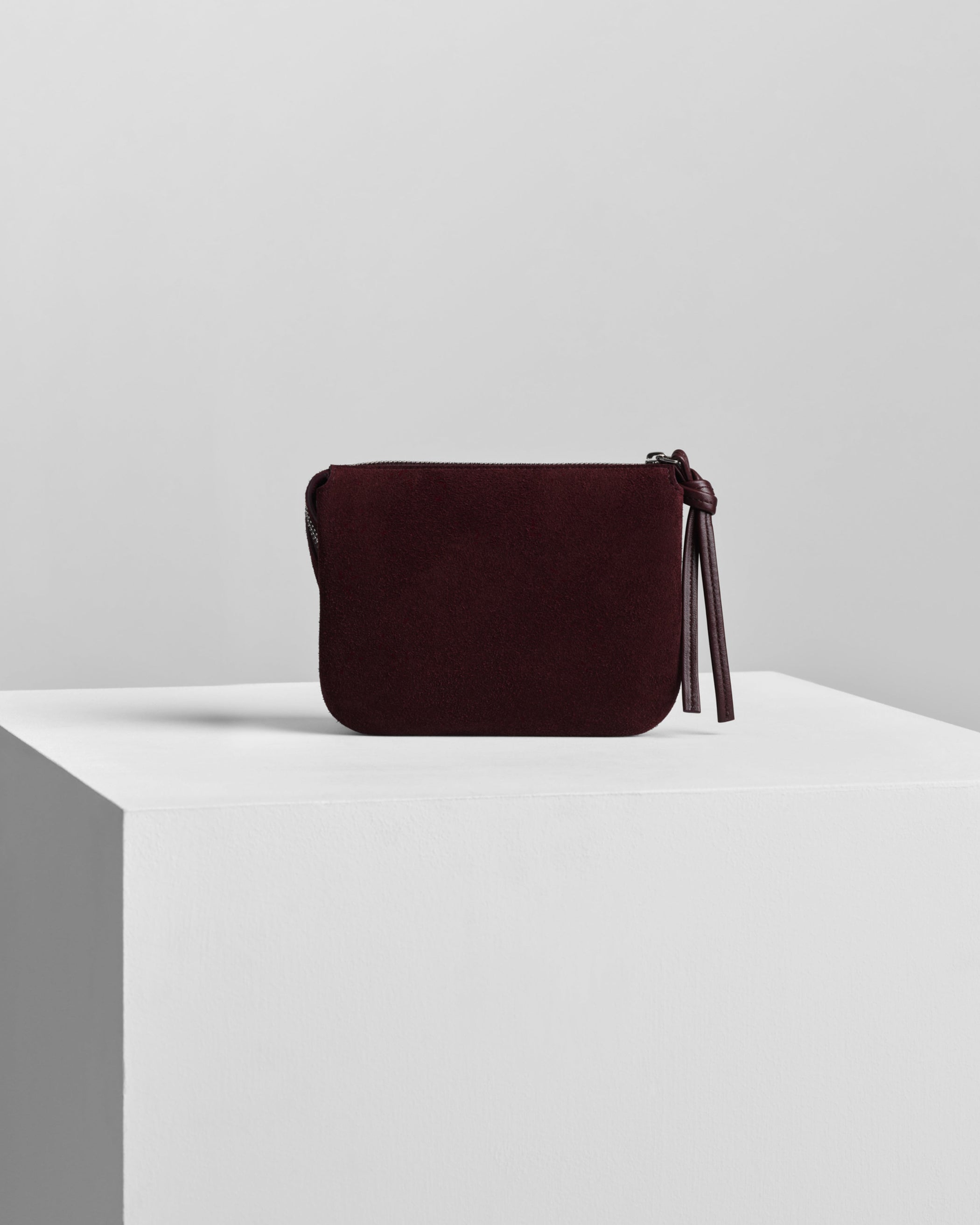 Back view of POCKET GIG in oxblood suede leather