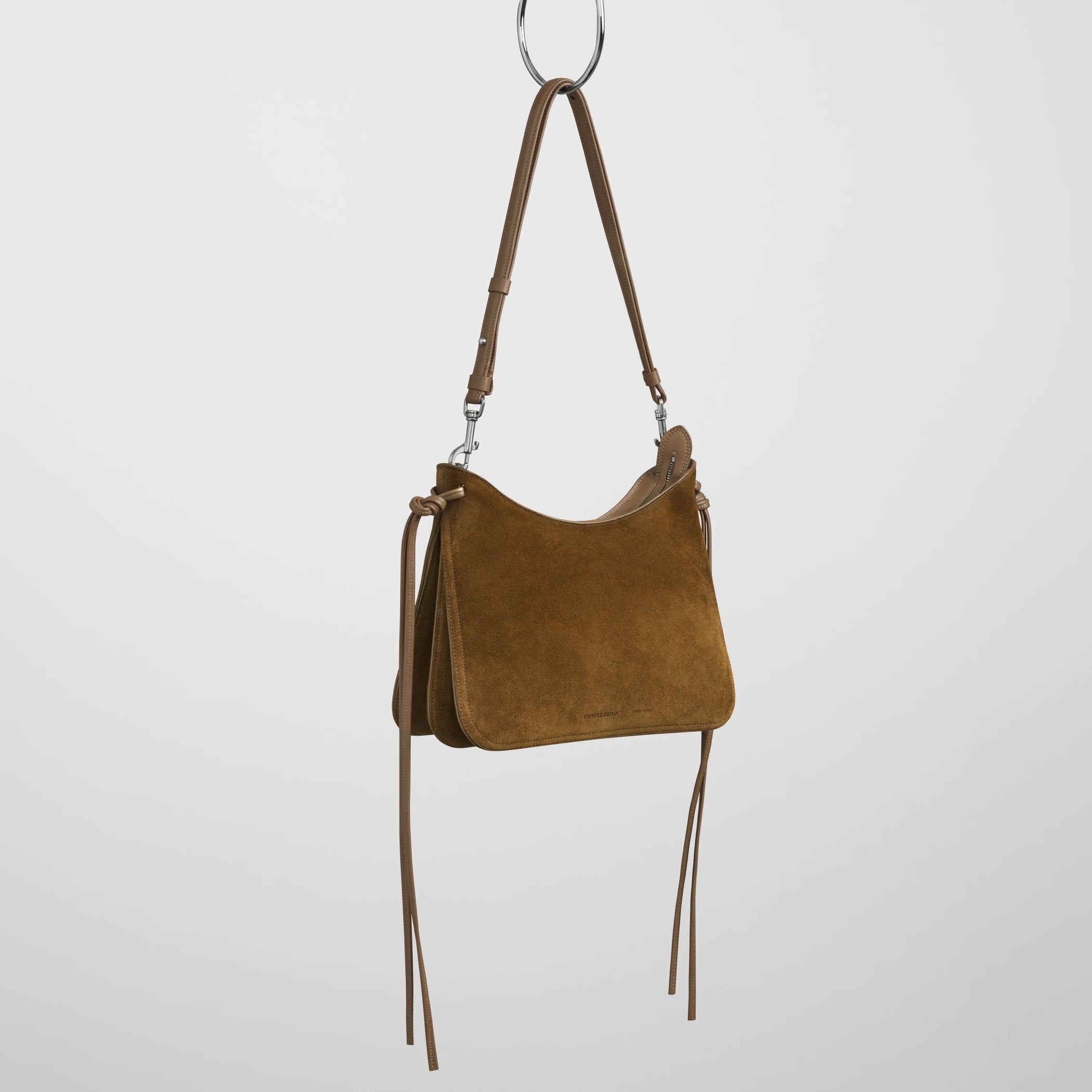 Angled view of small gig in toffee suede.