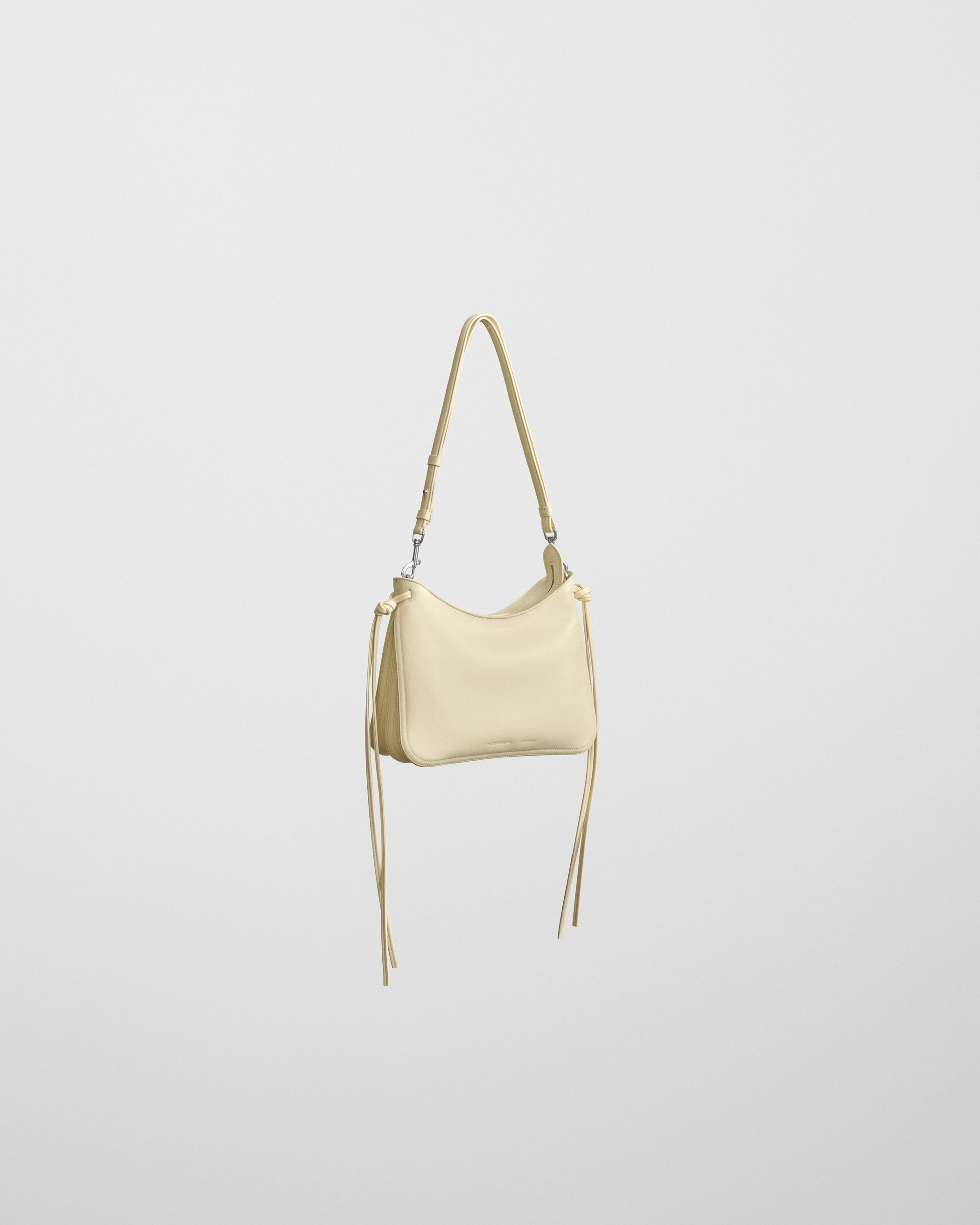 Angled front view of SMALL GIG BAG in stucco leather