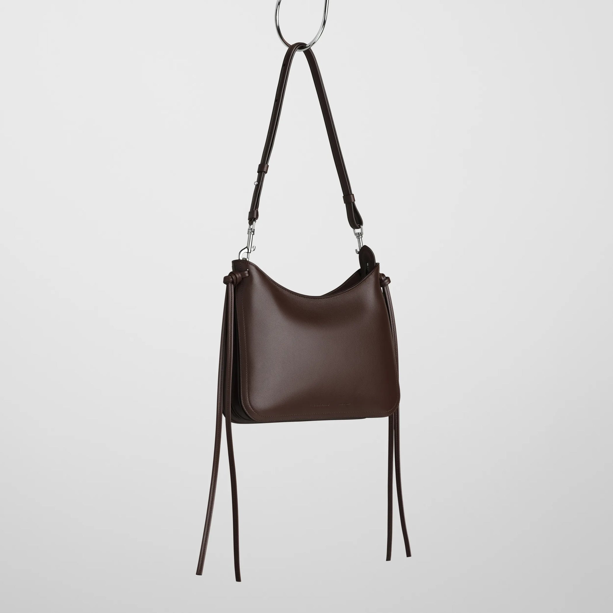 Angled view of small gig in cognac leather.