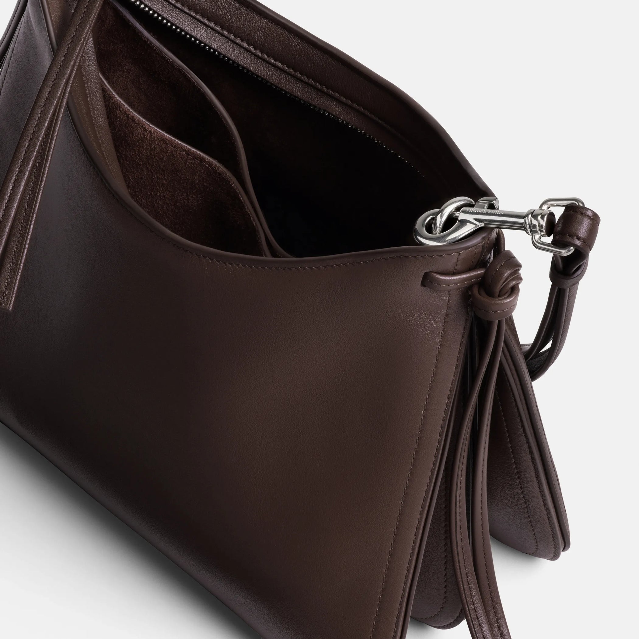 Close up detail view of small gig in cognac leather.