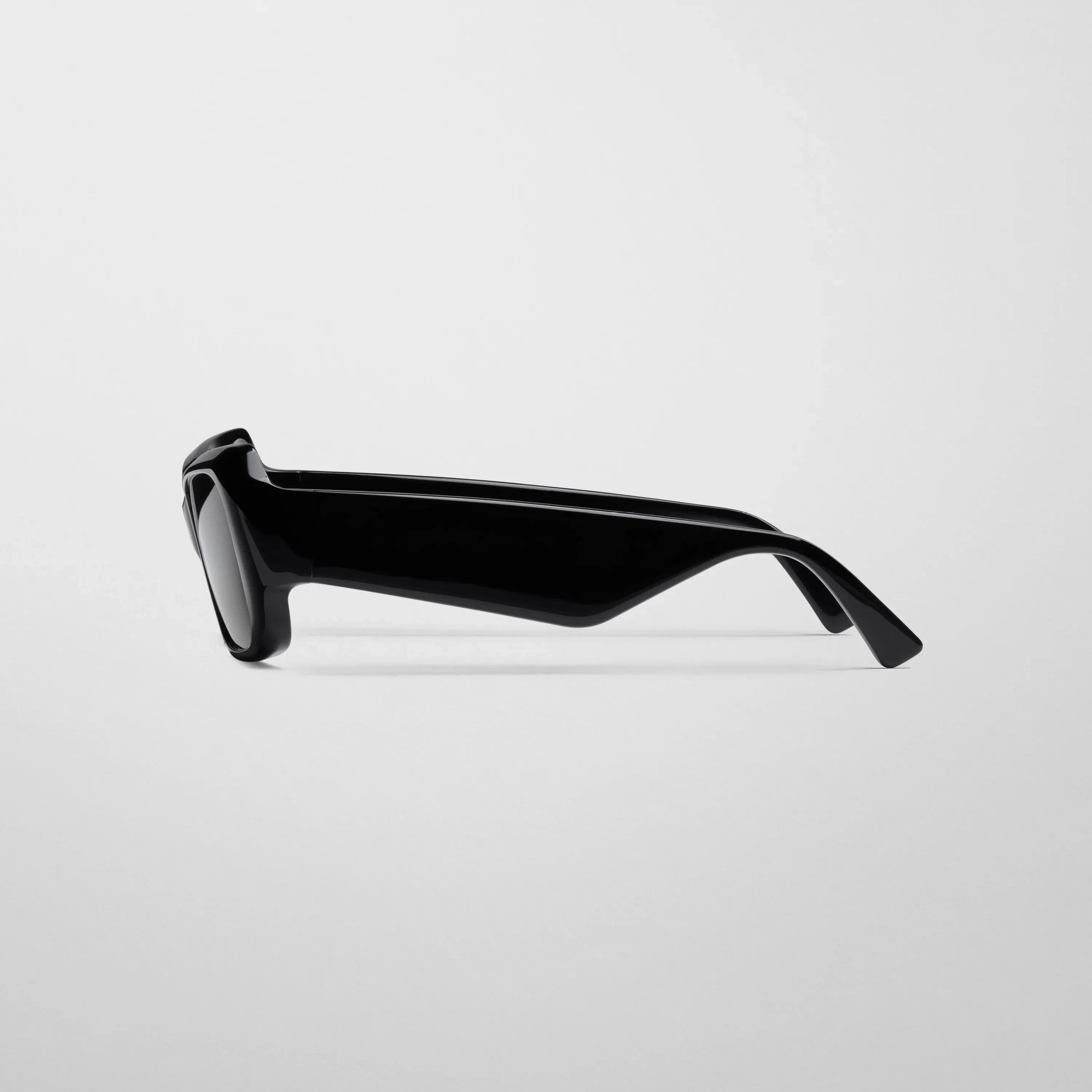 Side view of score sunglasses in black