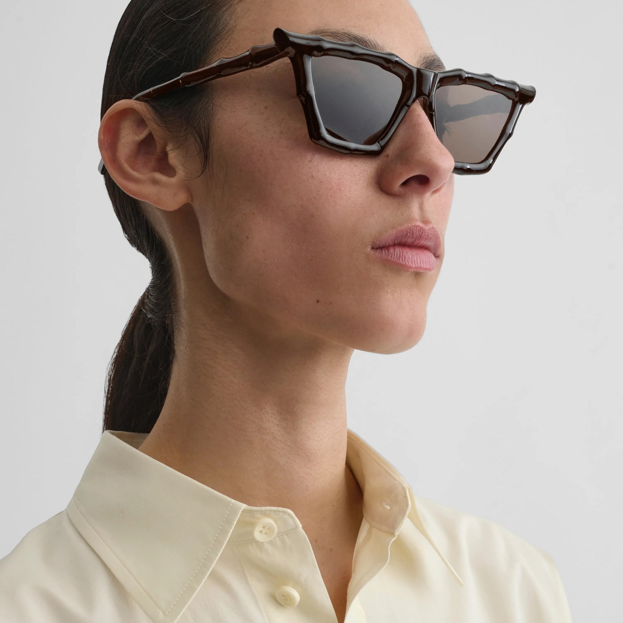 Close up detail view of bamboo sunglasses in dark brown rilsan