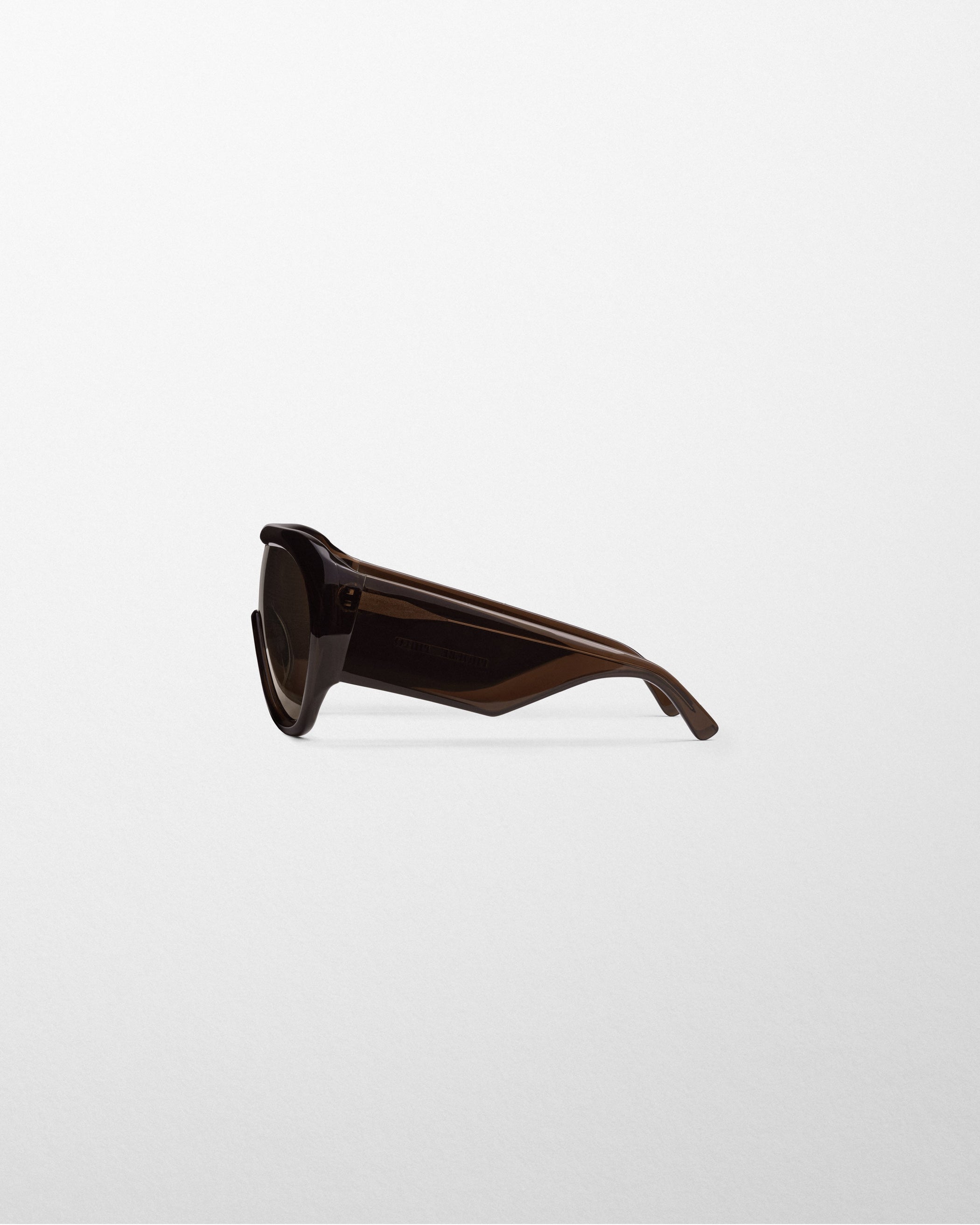 Side view of BOMBÉ SUNGLASSES in brown acetate