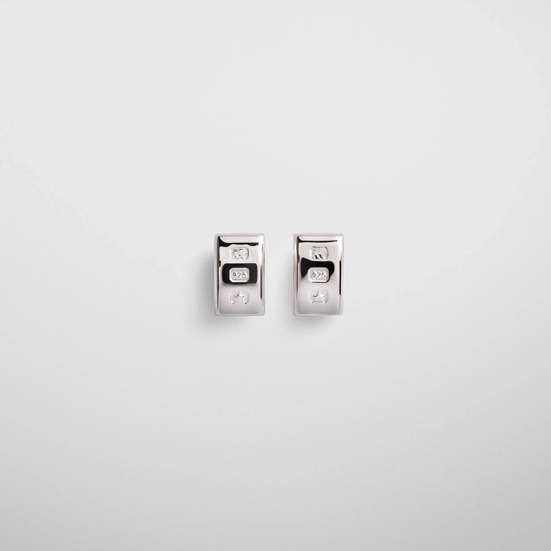 Flat front view of hallmark earrings in sterling silver.