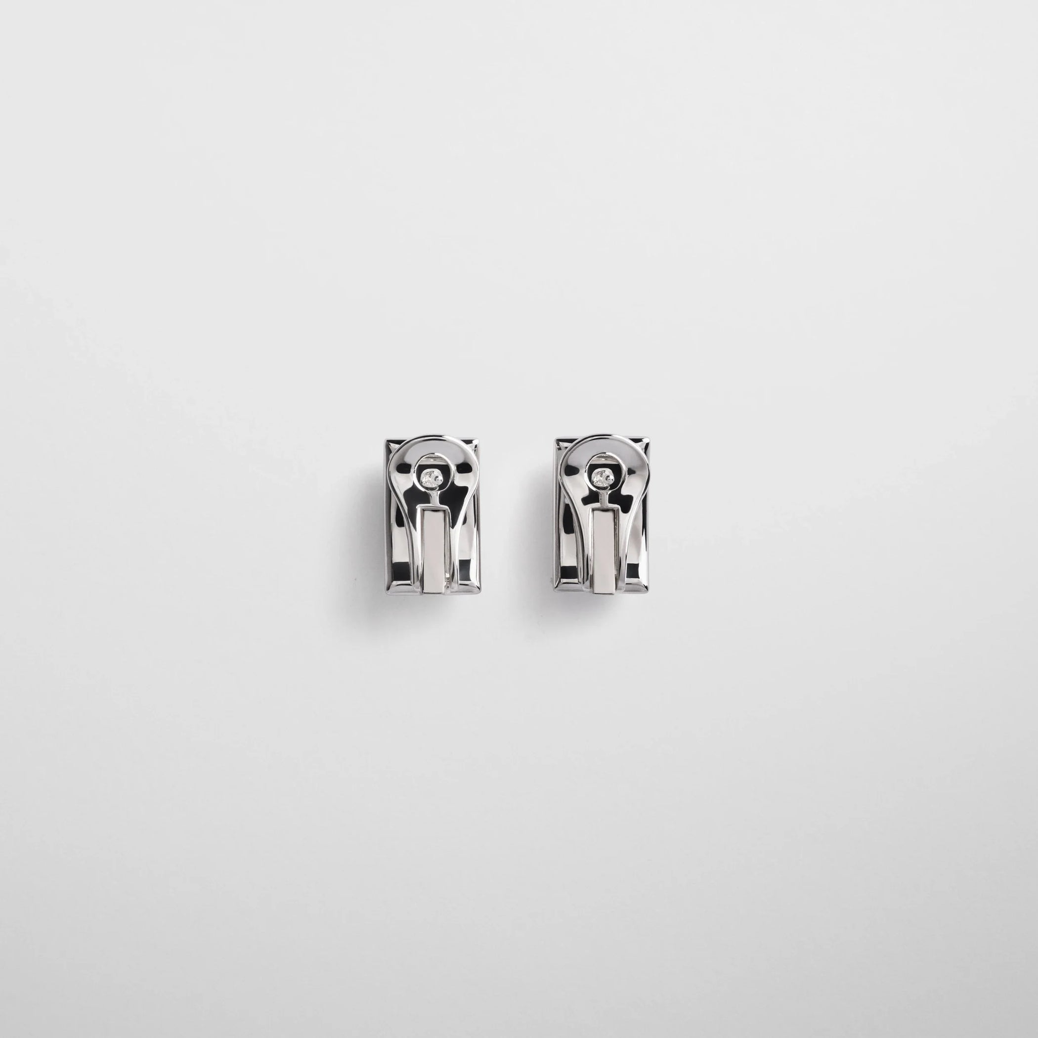 Flat back view of hallmark earrings in sterling silver.