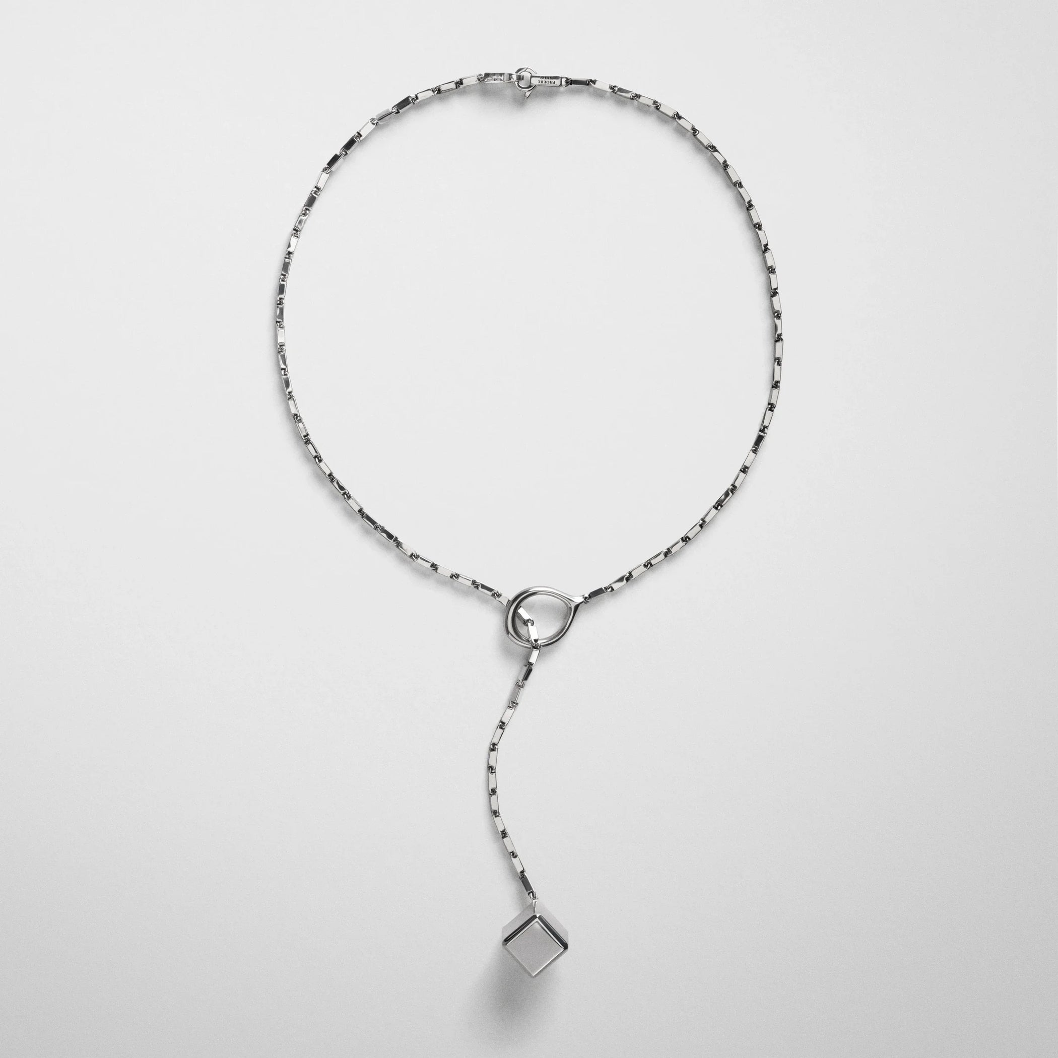 Flat front view of hoop tie pendant in sterling silver.