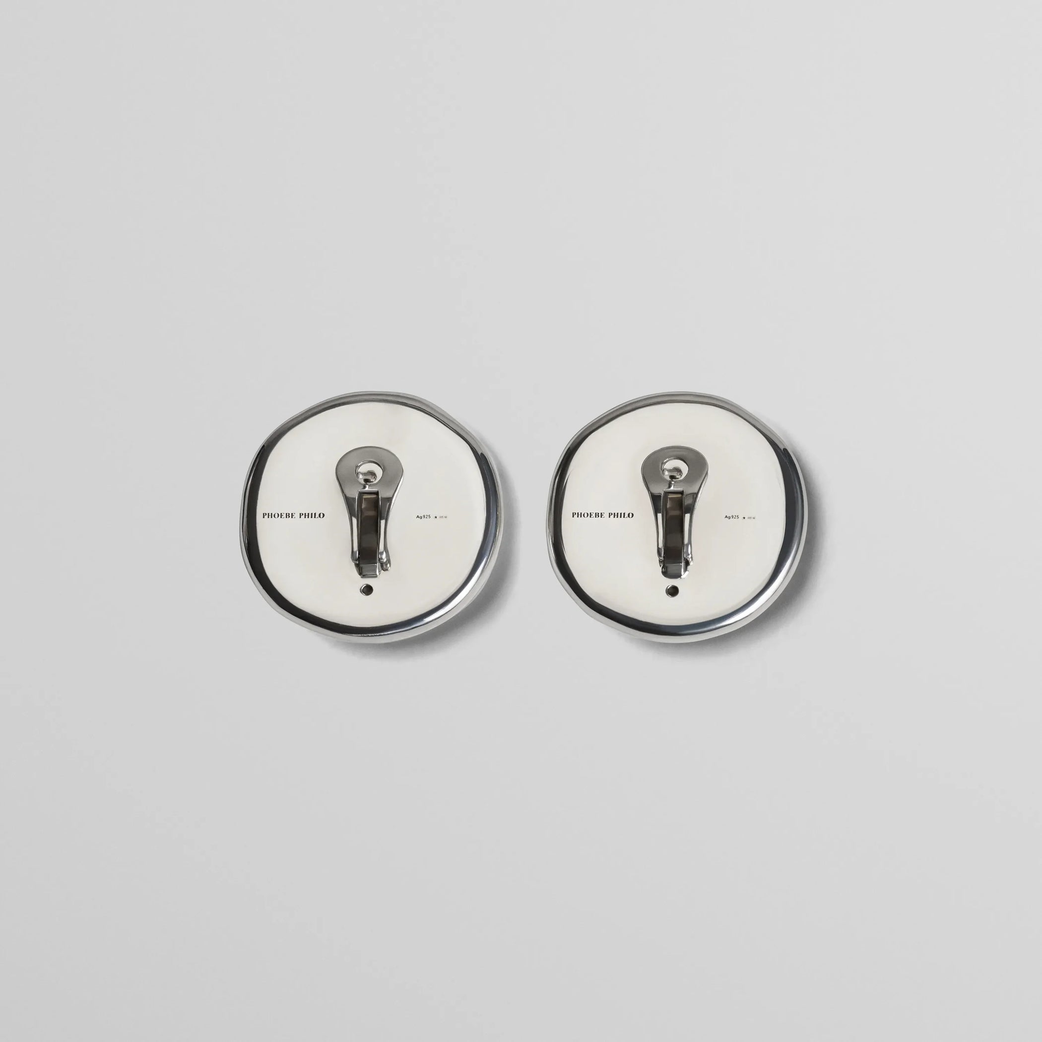 Flat back view of medallion dish earrings in sterling silver