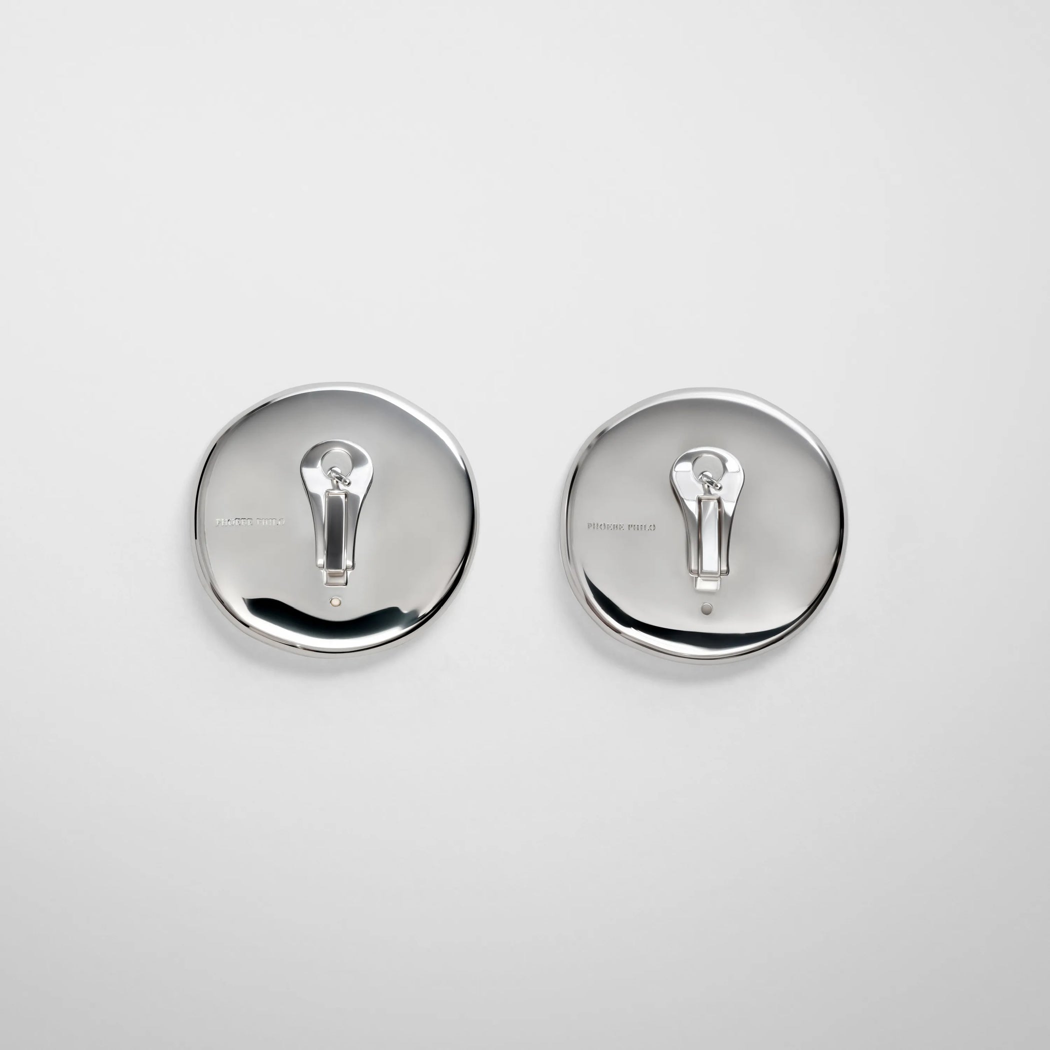 Back view of medallion earrings in white