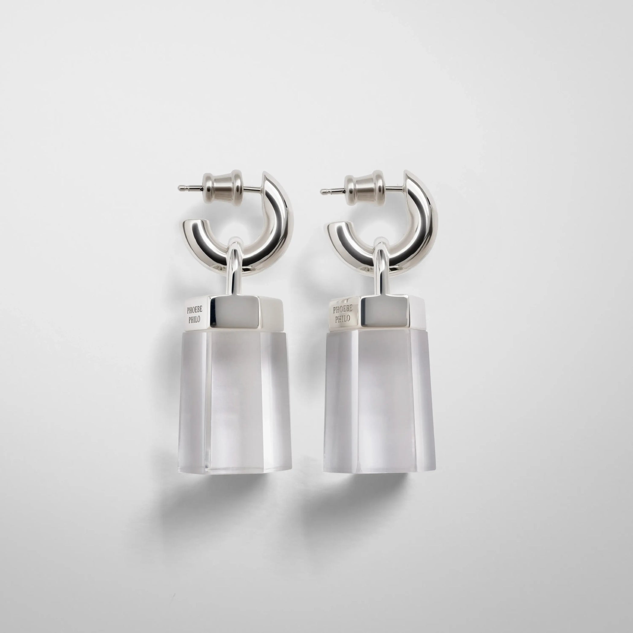 side view of prism earrings in clear resin.