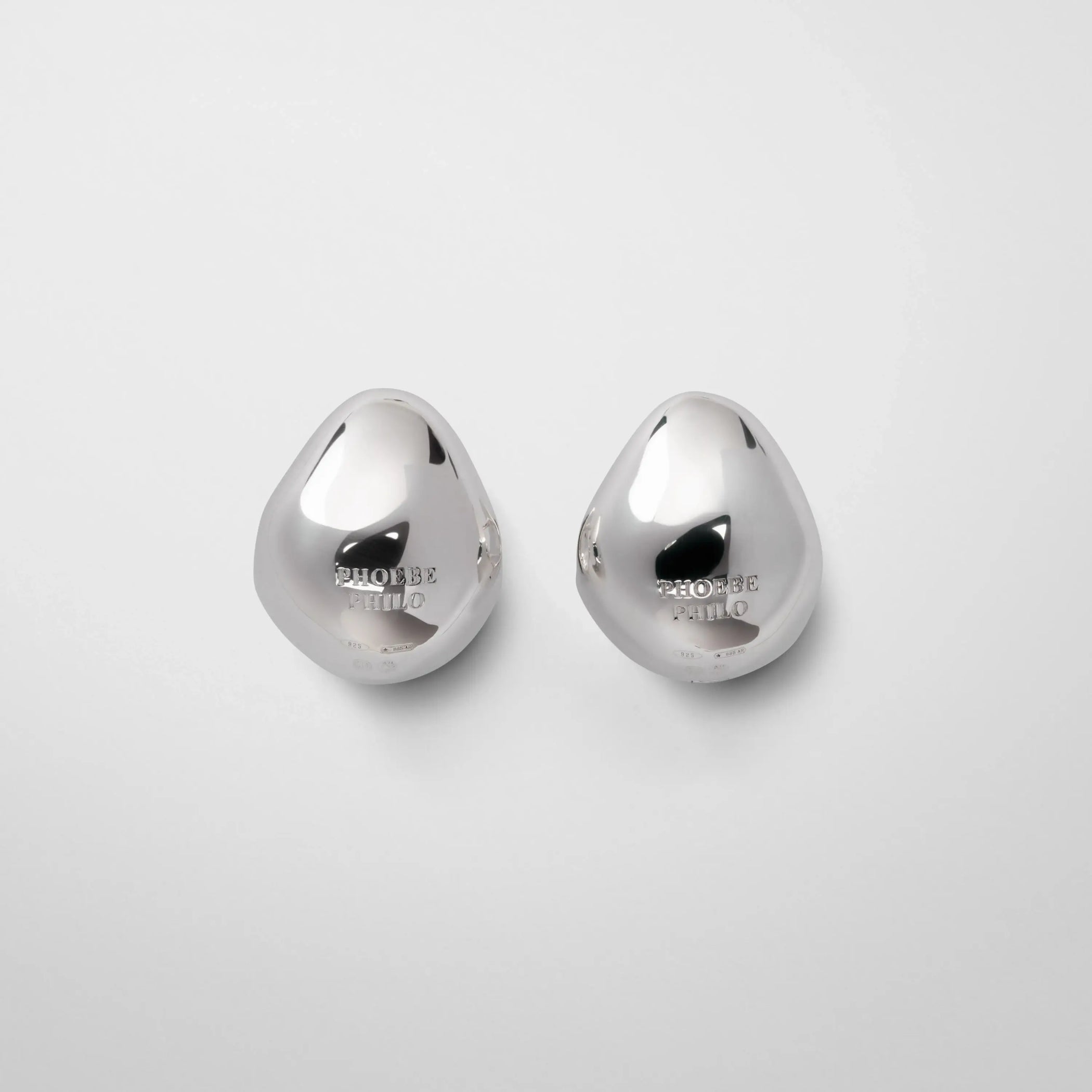 Flat back view of pebble stud earrings in sterling silver.