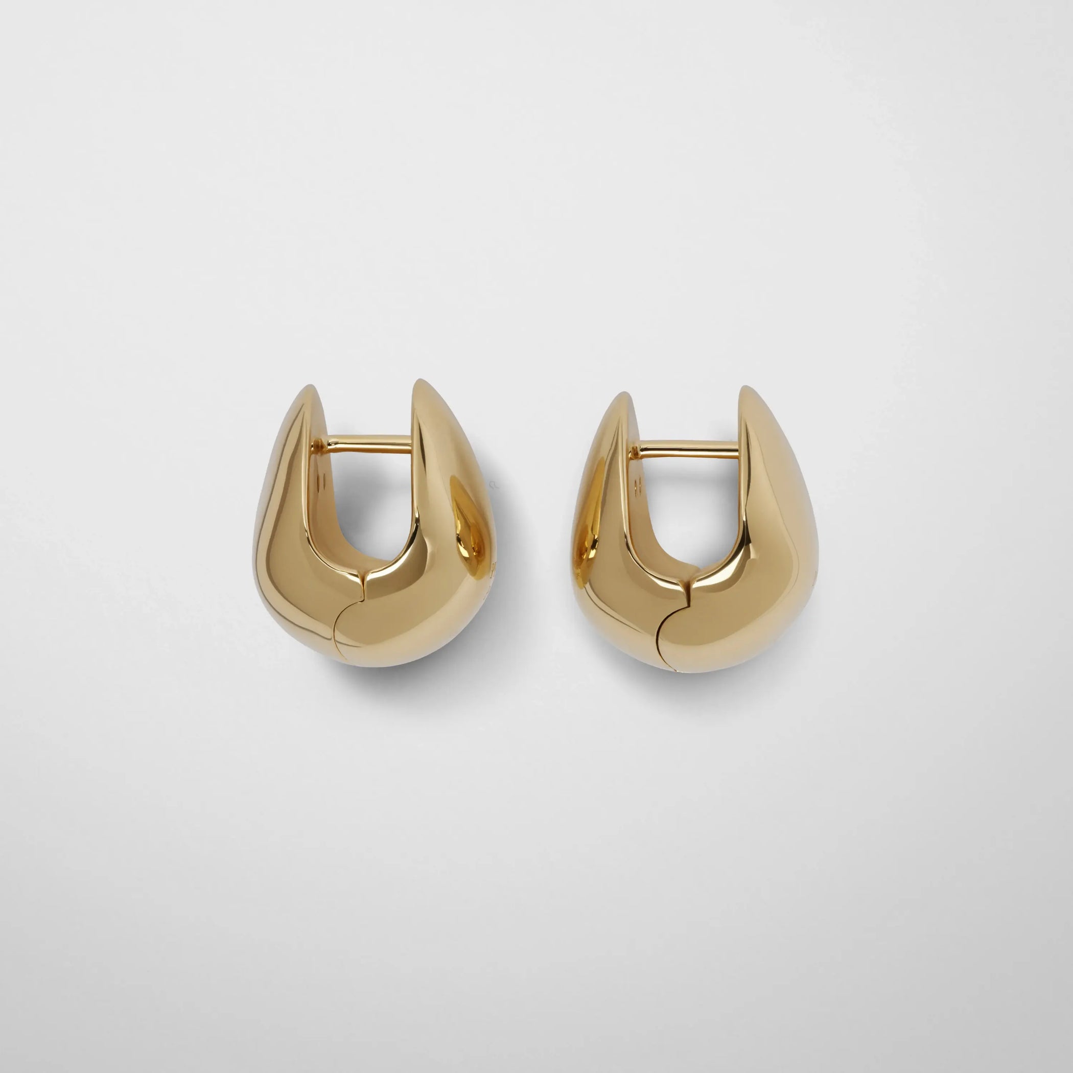 Side view of pebble stud earrings in gold plated sterling silver