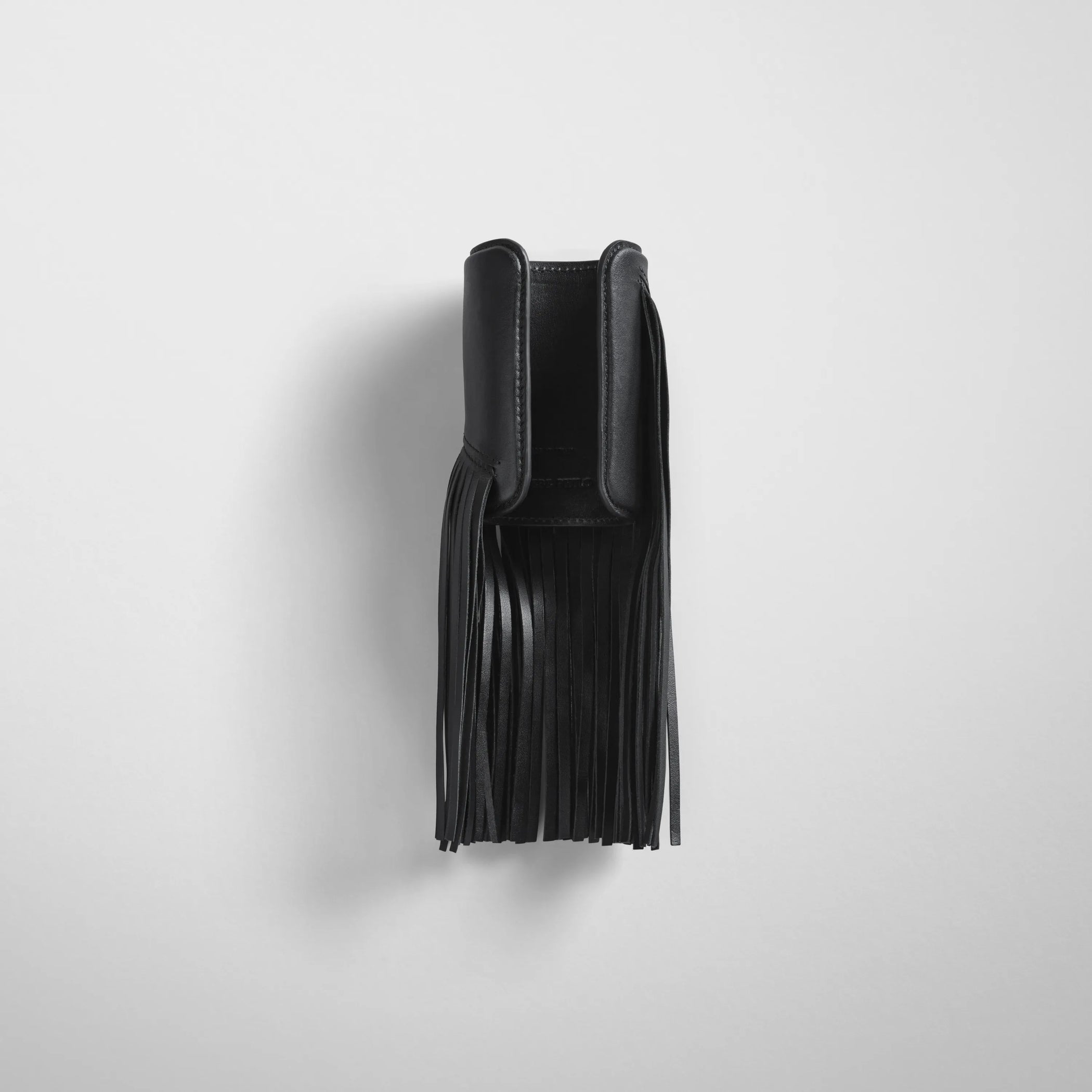 Back view of fringe cuff in black