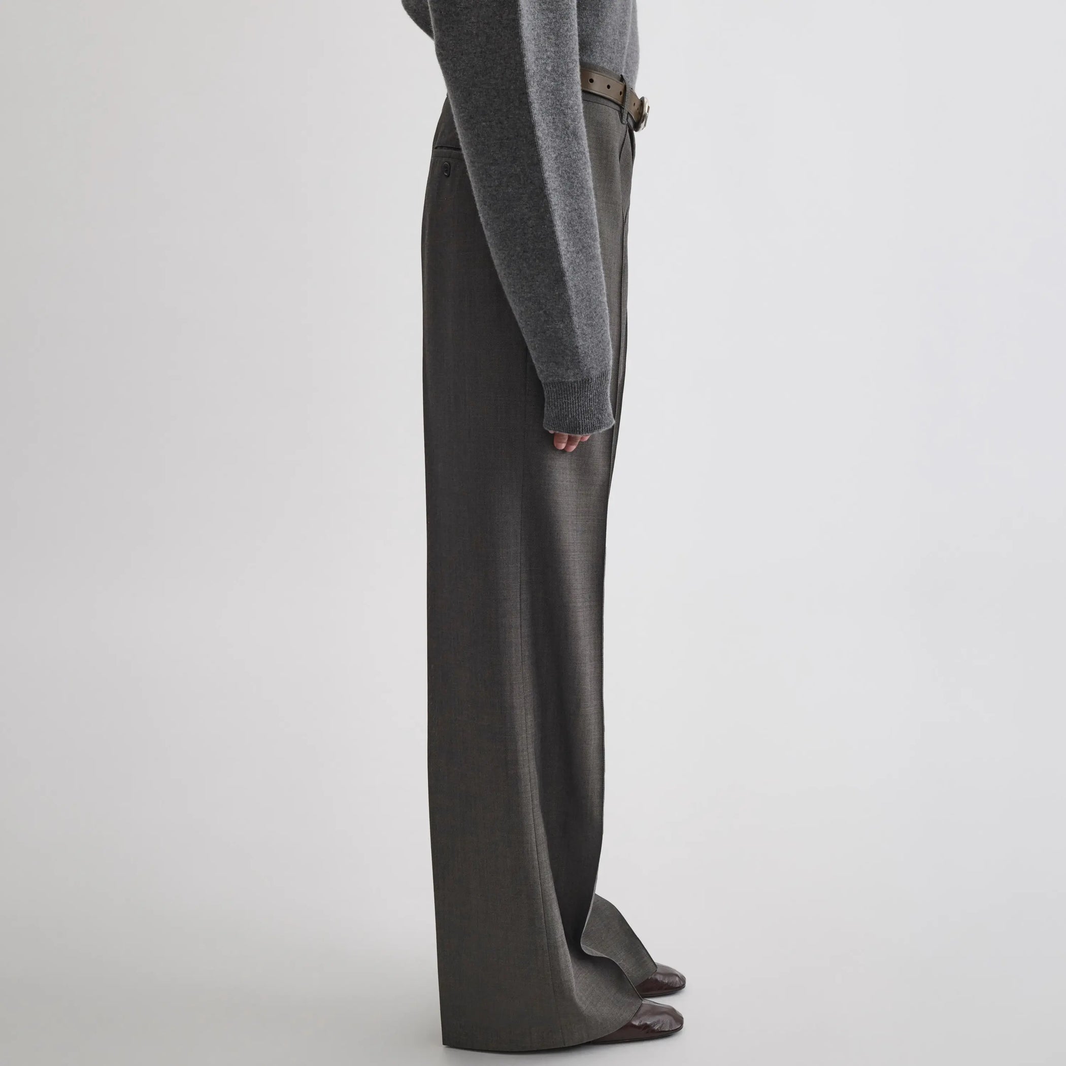 Side view of boyish tailored trousers in dark taupe wool