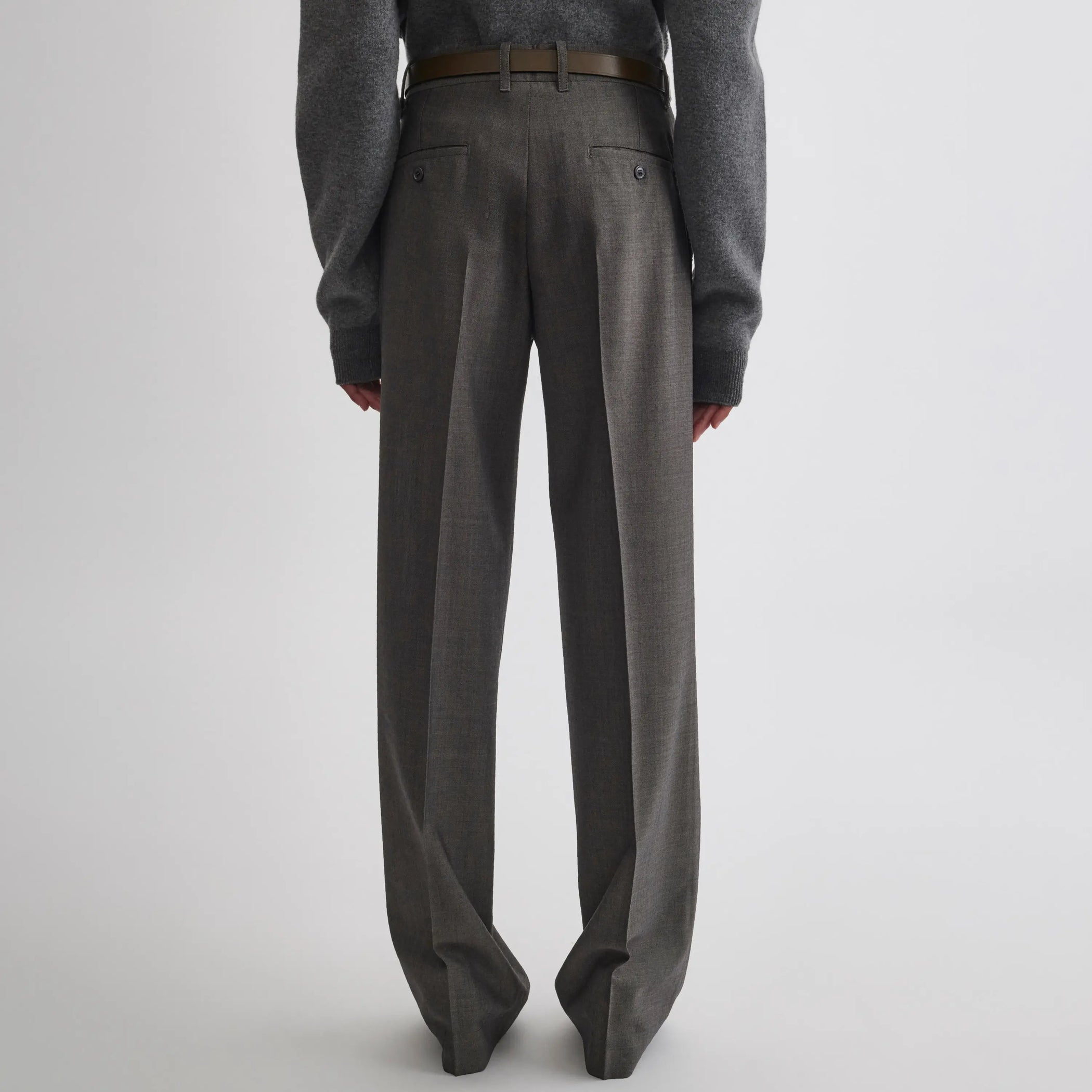Back view of boyish tailored trousers in dark taupe wool