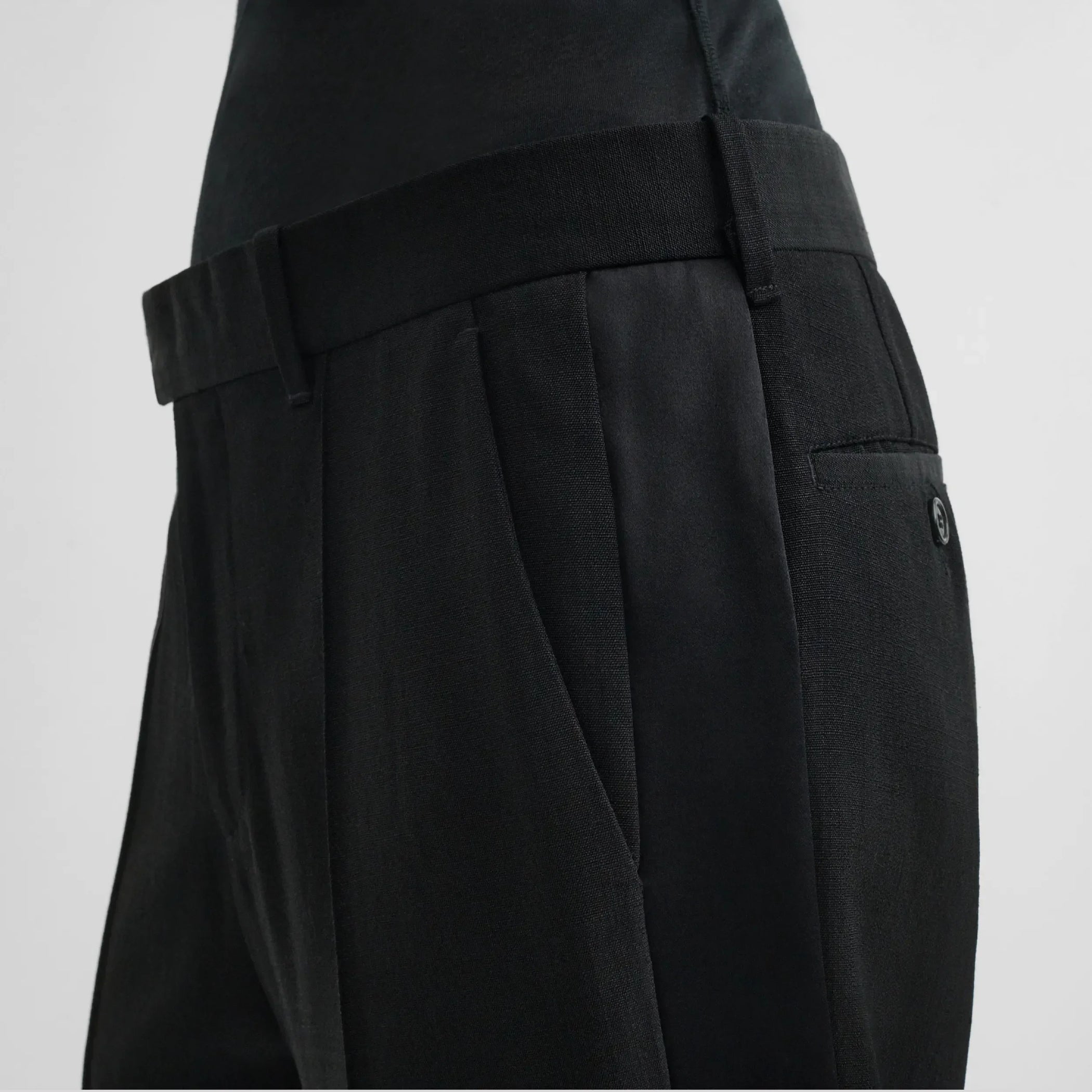 Close up detail view of tux trousers in black viscose