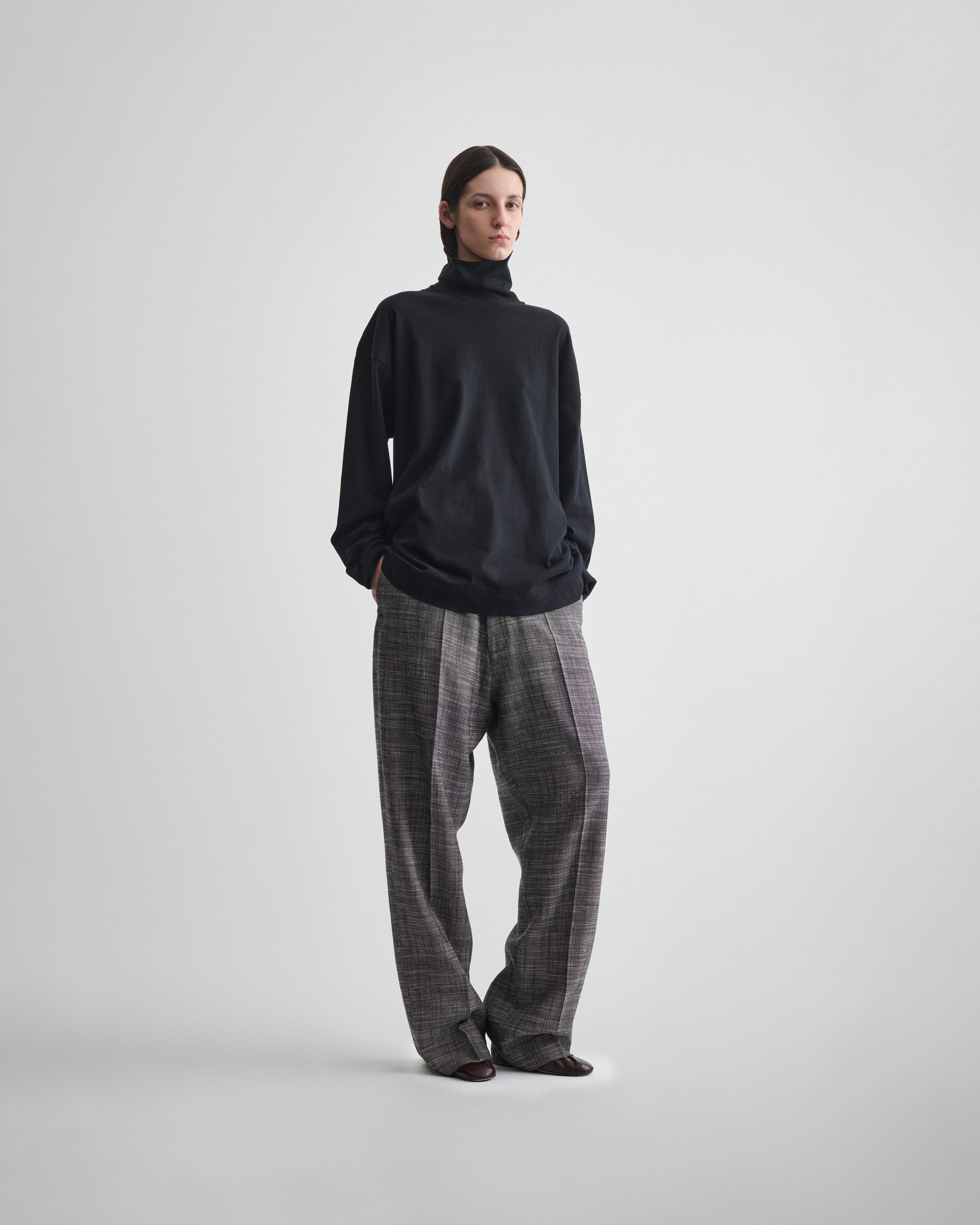 Full length front view of model wearing DROP TROUSERS in blue grey melange woven viscose