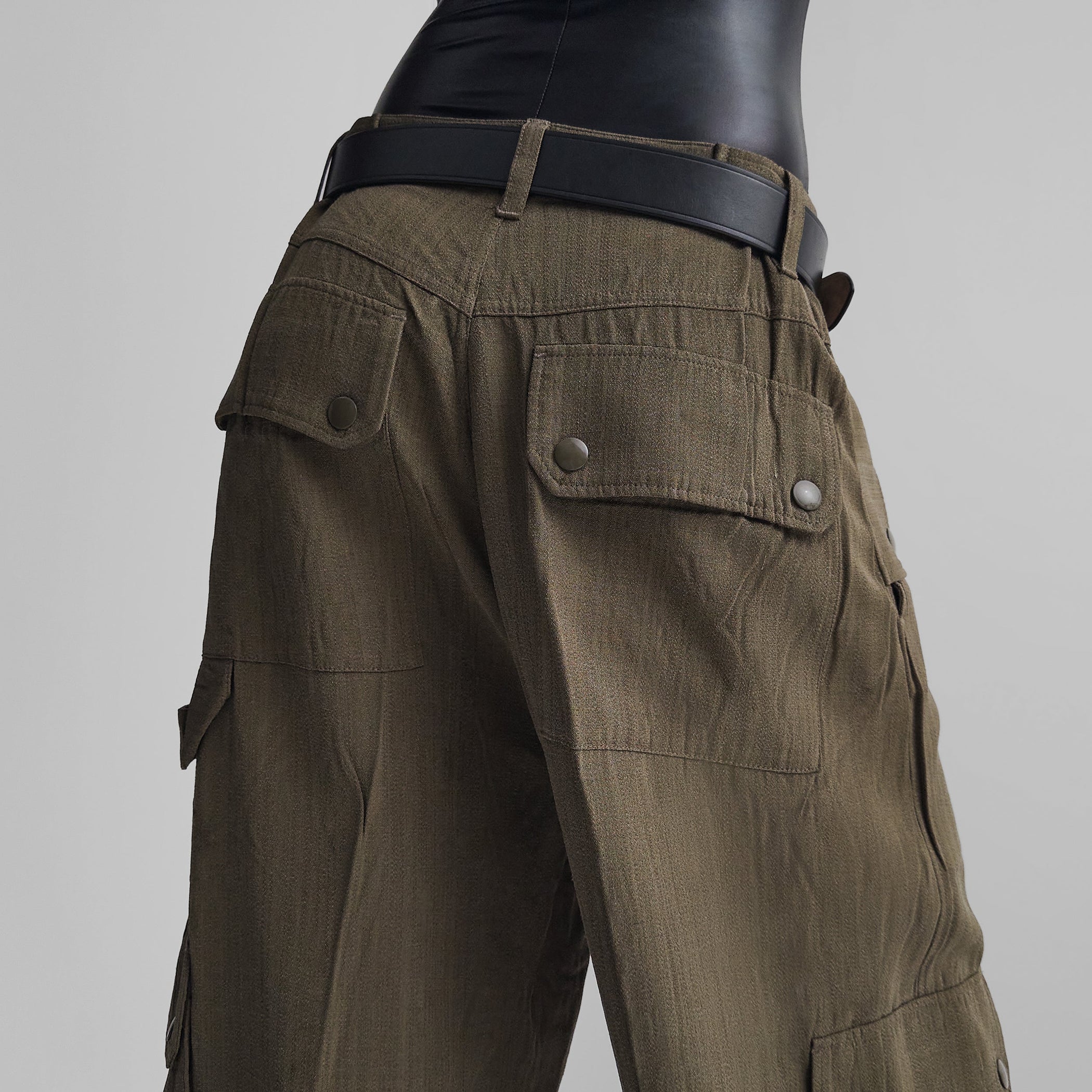 Detail view of model wearing PATCH POCKET CARGO TROUSERS in shroom