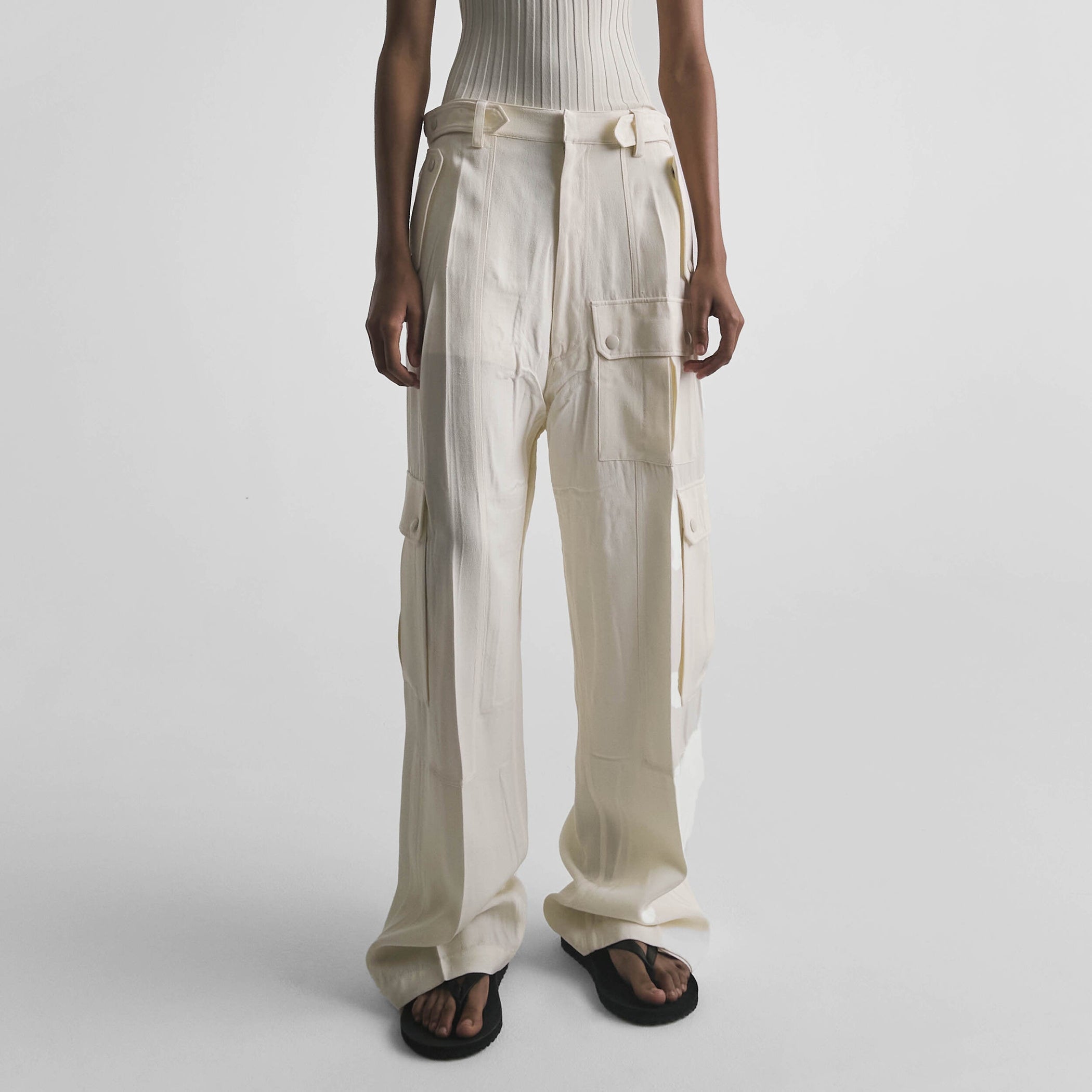 Front view of model wearing PATCH POCKET CARGO TROUSERS in parchment viscose silk