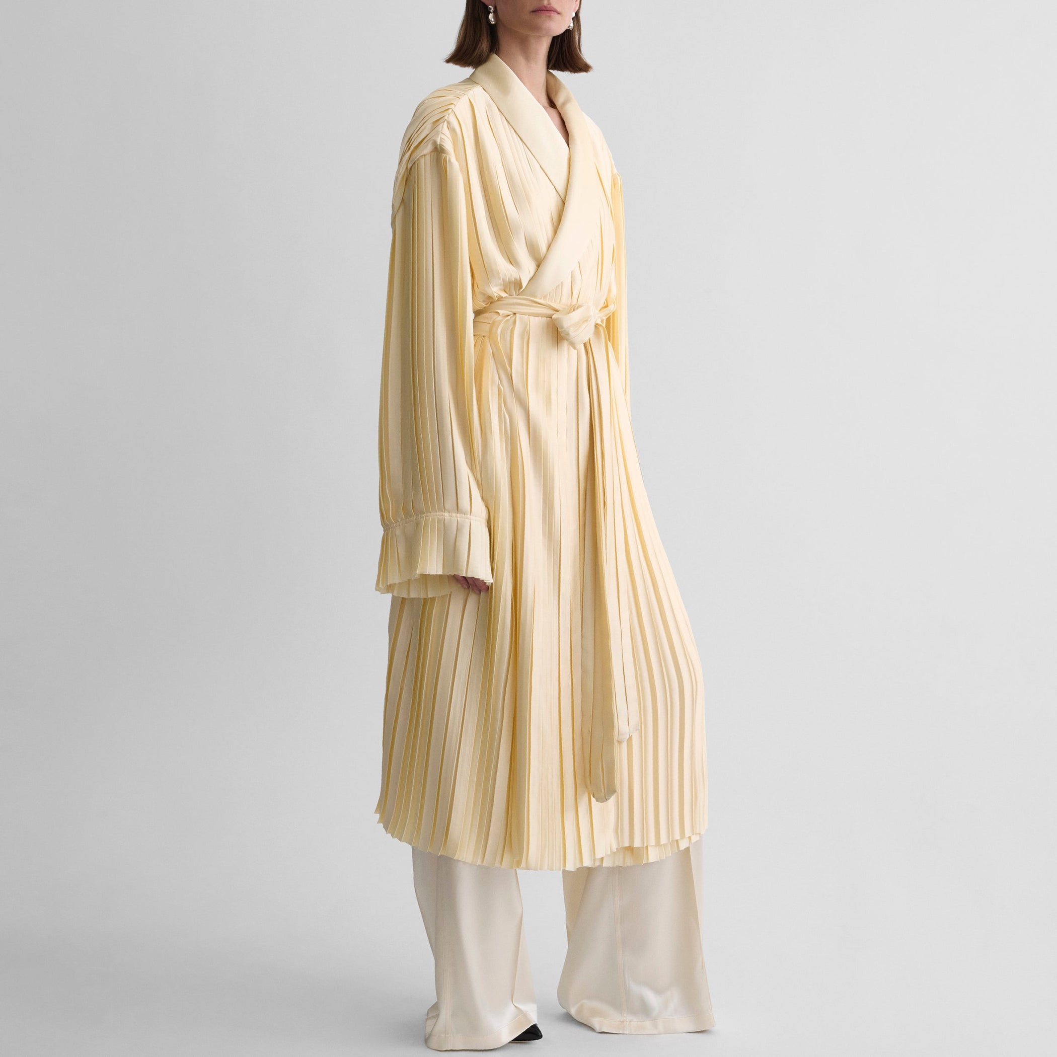 Side view of model wearing PLEATED ROBE in vanilla satin