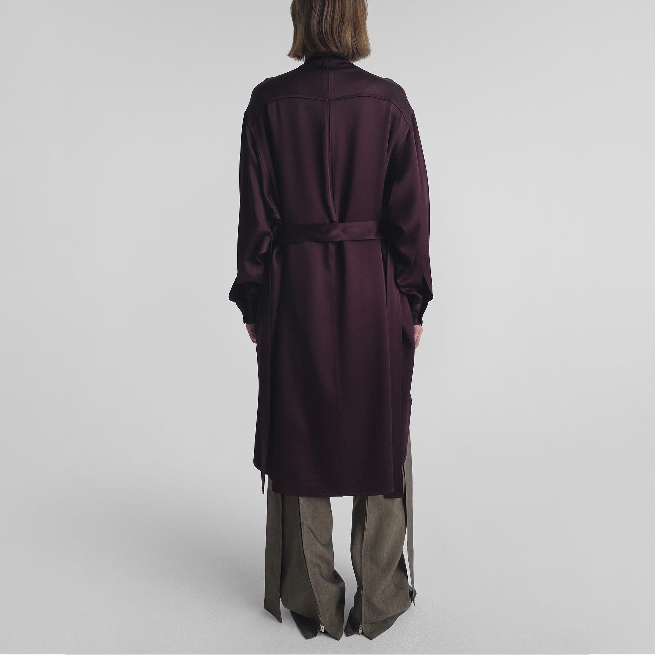 Back view of model wearing DRESS in dark berry satin back crepe