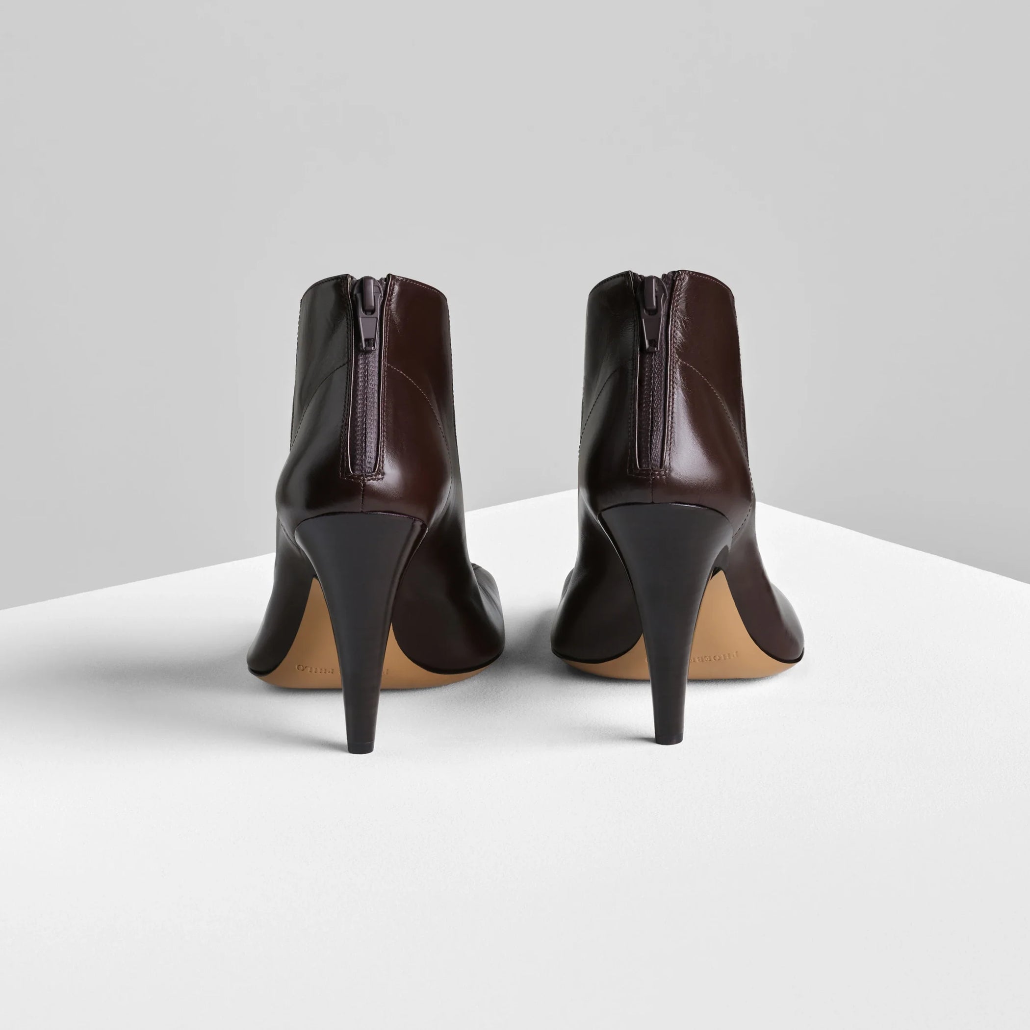 Back view of tilt ankle boot in oxblood leather.