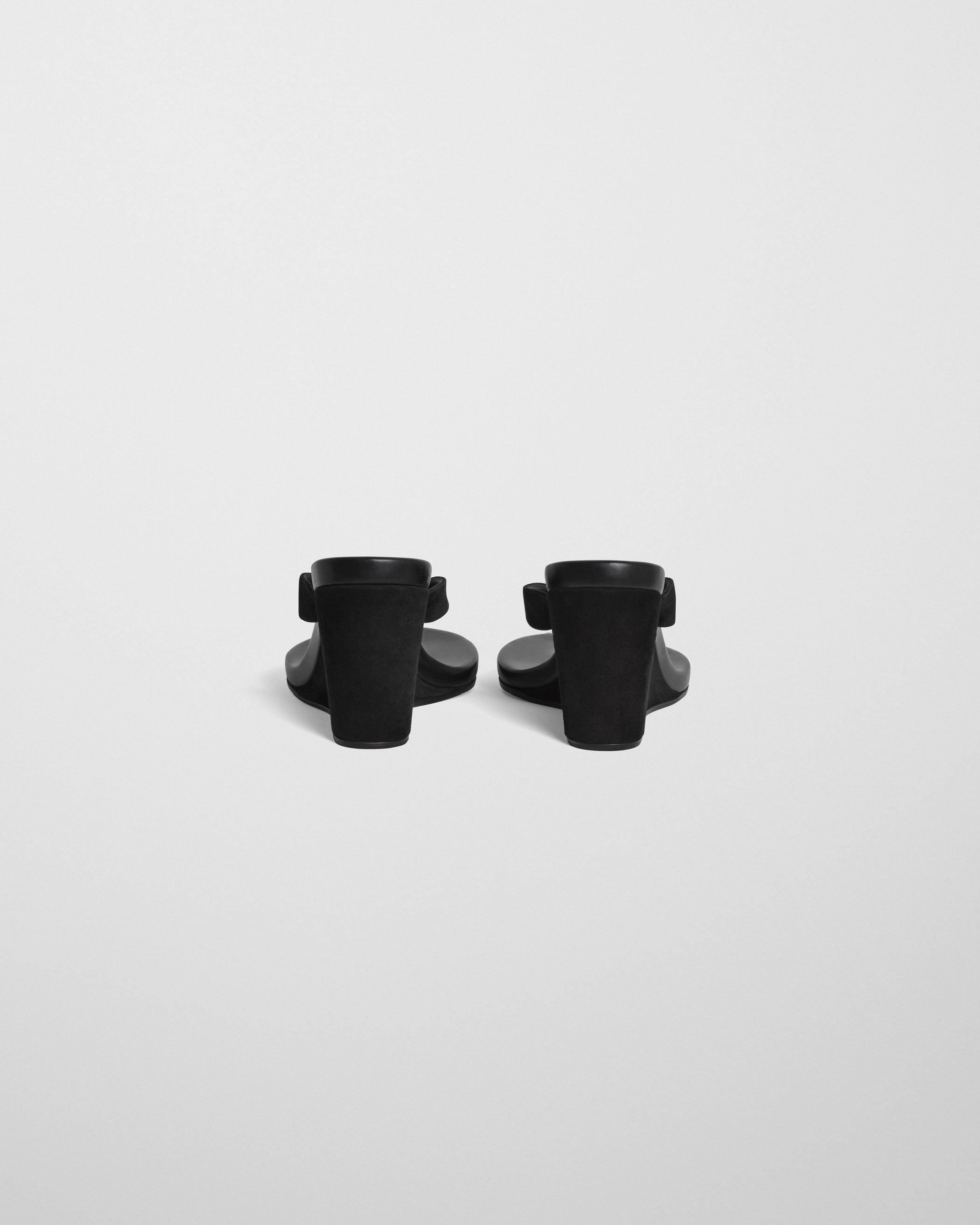 Back view of ROUND WEDGE in black suede