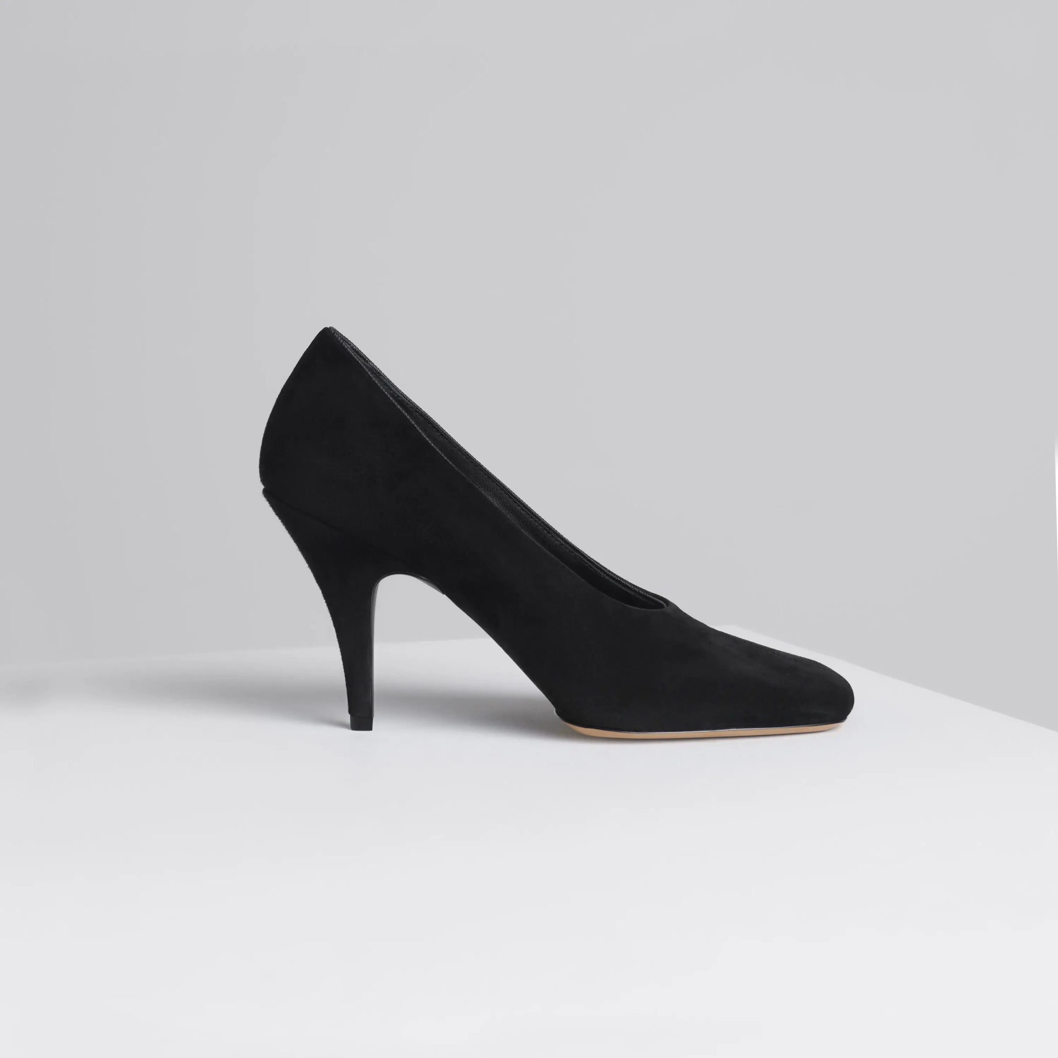 Side view of soft pump 90 in suede black