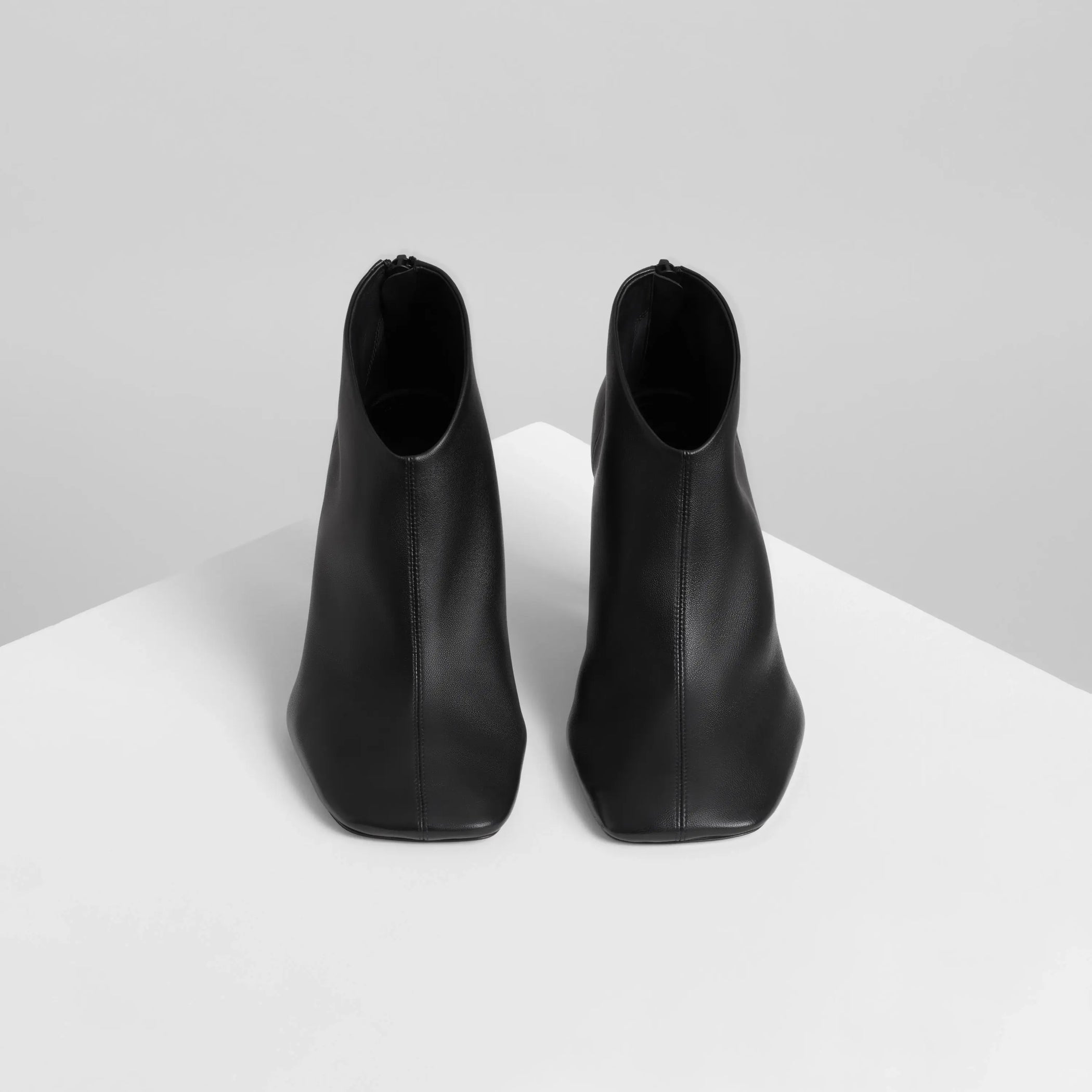 Front view of soft ankle boot 90 in black leather.