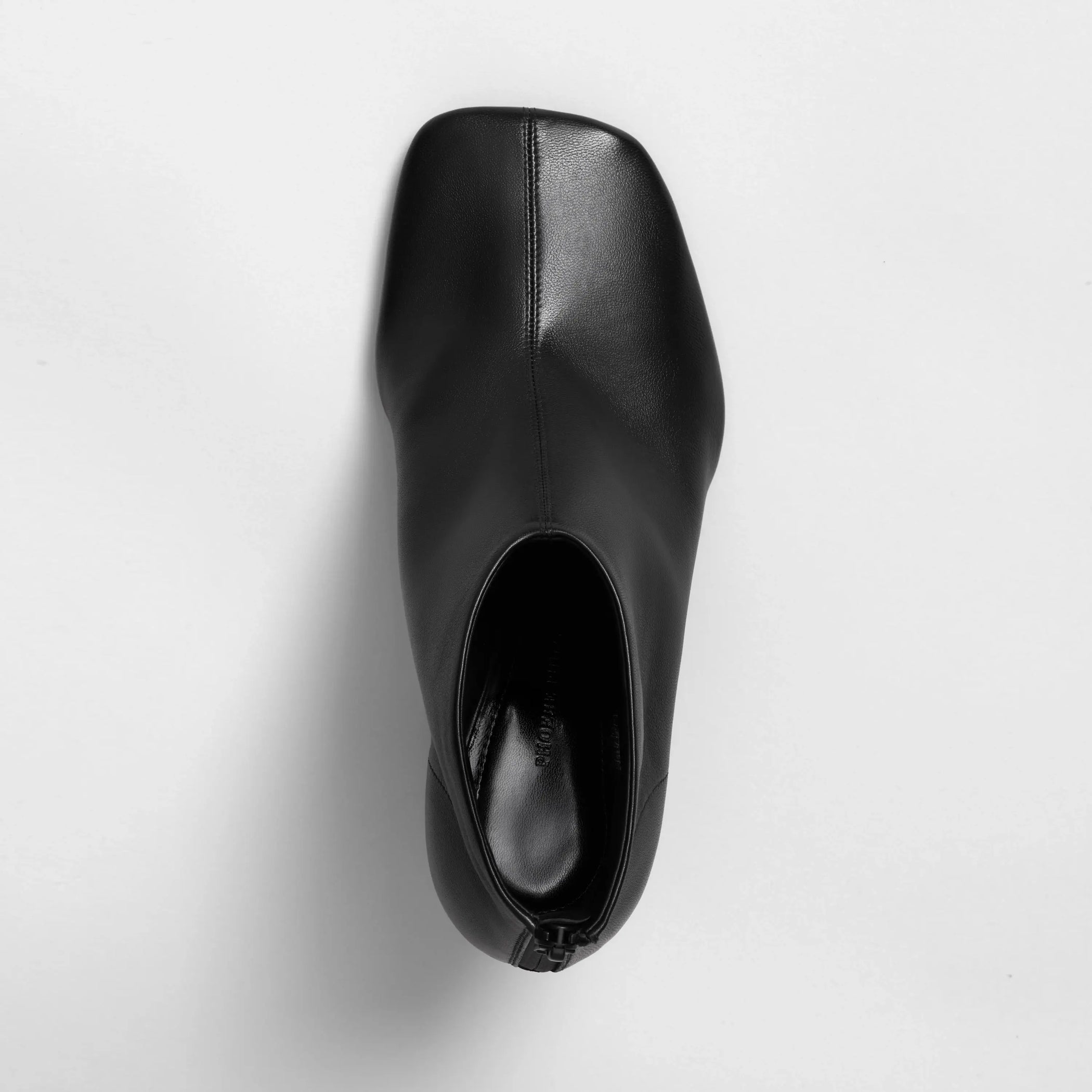 Top view of soft ankle boot 90 in black leather.