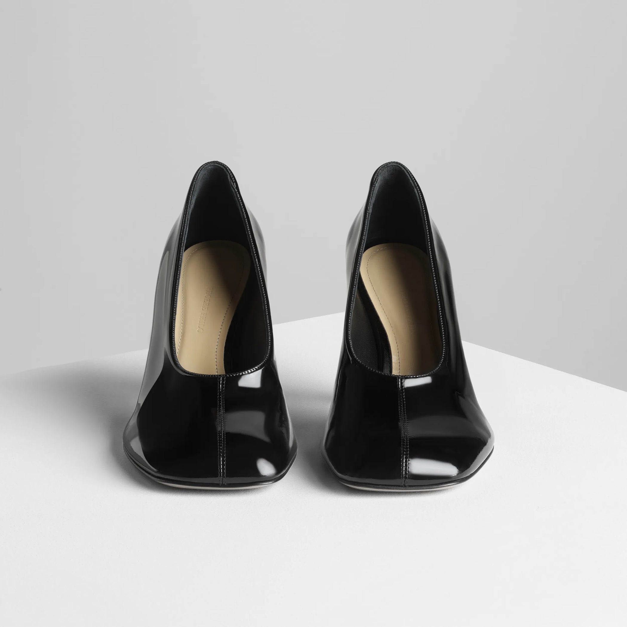 Front view of soft pump 90 in black patent leather.