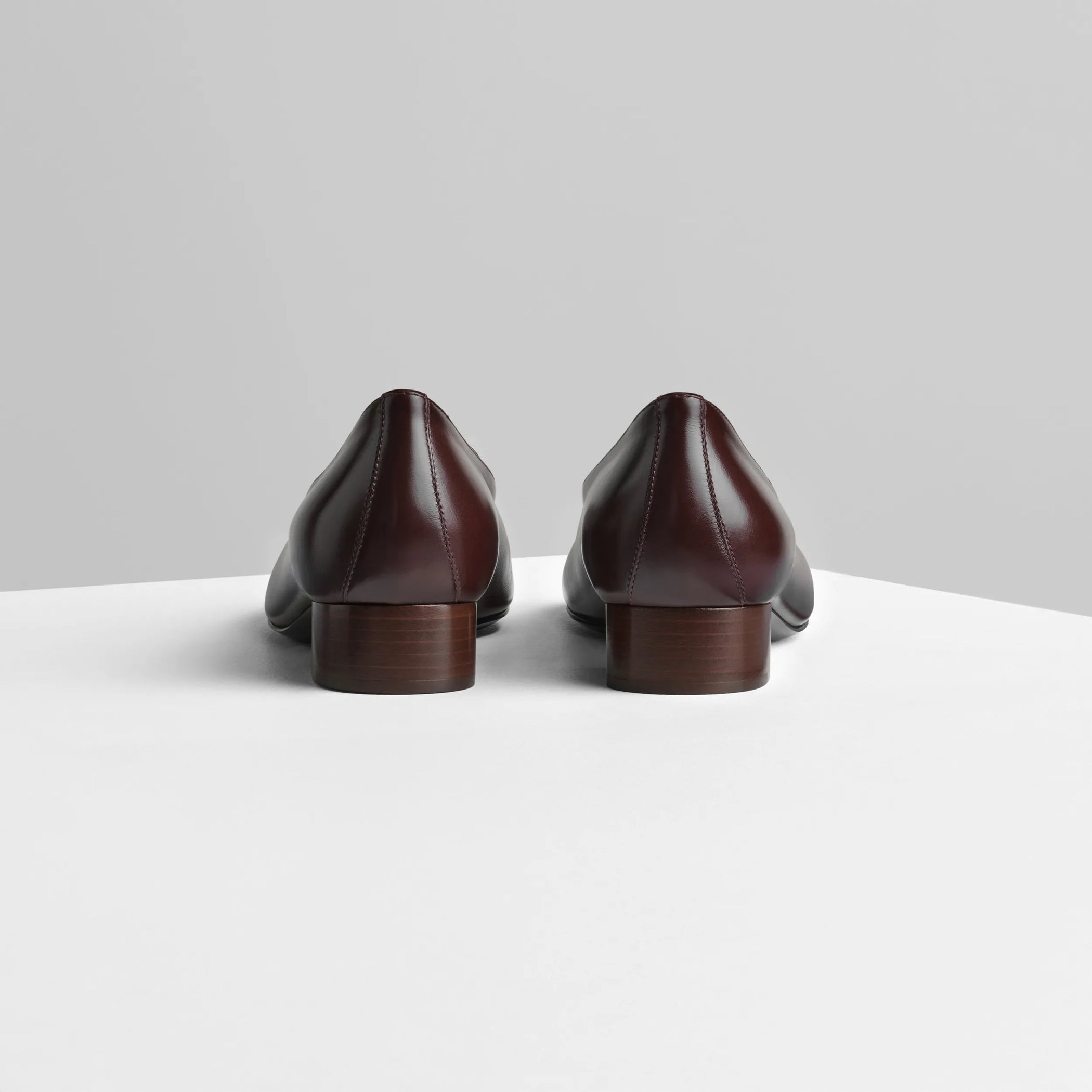 Back view of club slipper in oxblood shiny leather