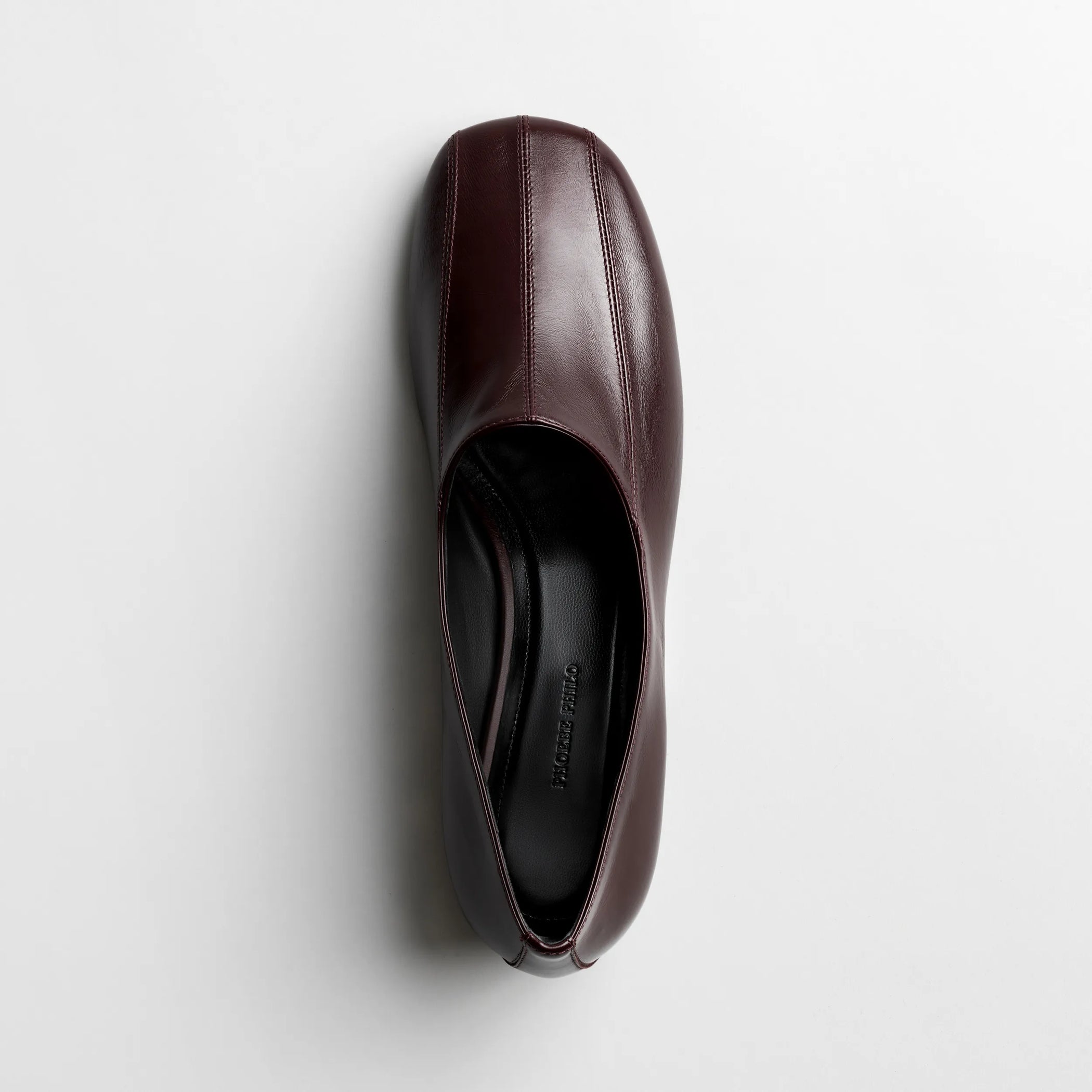 Top view of club slipper in oxblood shiny leather
